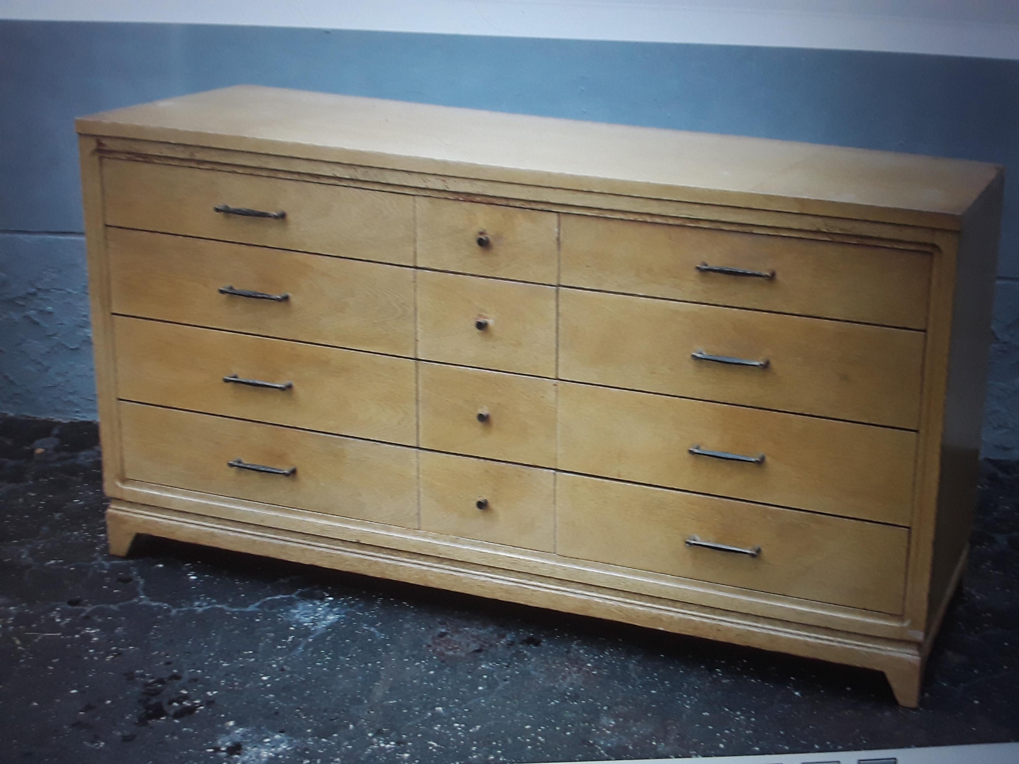 1960's Modern Light Toned Wood 12 Drawer Standard Dresser. This dresser has unique hardware.