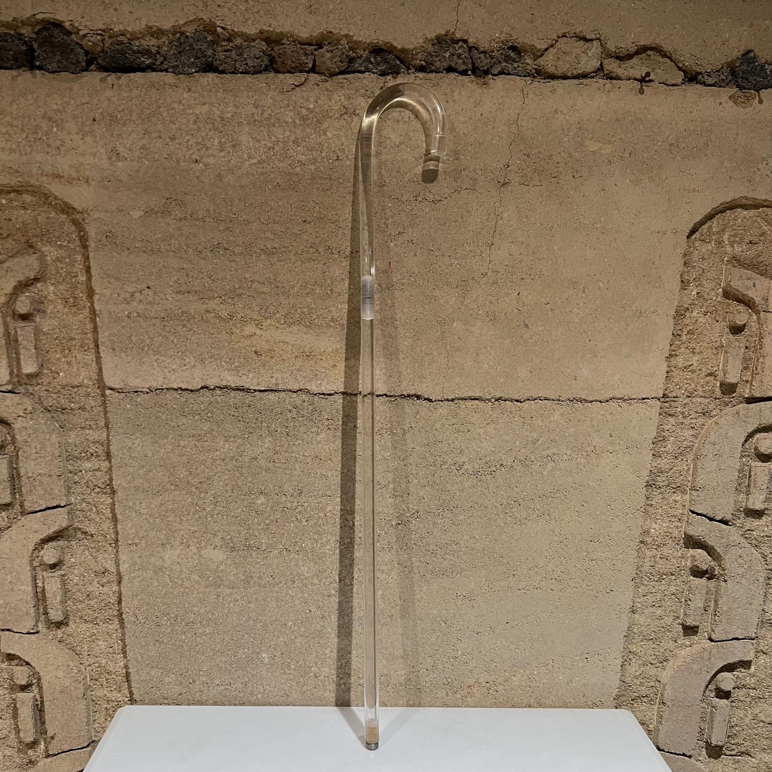 Lucite cane
1960s Stylish crook cane vintage walking stick made of lucite with solid steel tip.
Clean modern lines.
No maker stamp, style of Grosfeld House Charles Hollis Jones.
Measures: 36.5 tall x .88 thick x 5 wide.
Original preowned