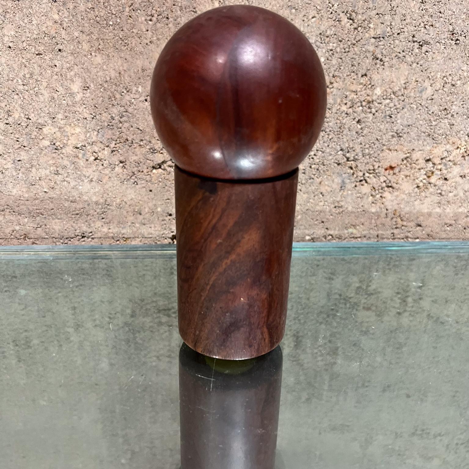 
1960s Modern Nesting Salt & Pepper Shaker Rosewood Ball + Cylinder
 6.25 H x 3 inches Diameter Ball 3 x 3 Cylinder 3.5 H x 2.25 inches diameter
Original caps in yellow. stamped CAP LUGS, EP-16, MAS 820-16-165
Small nicks present. Hard to see, but