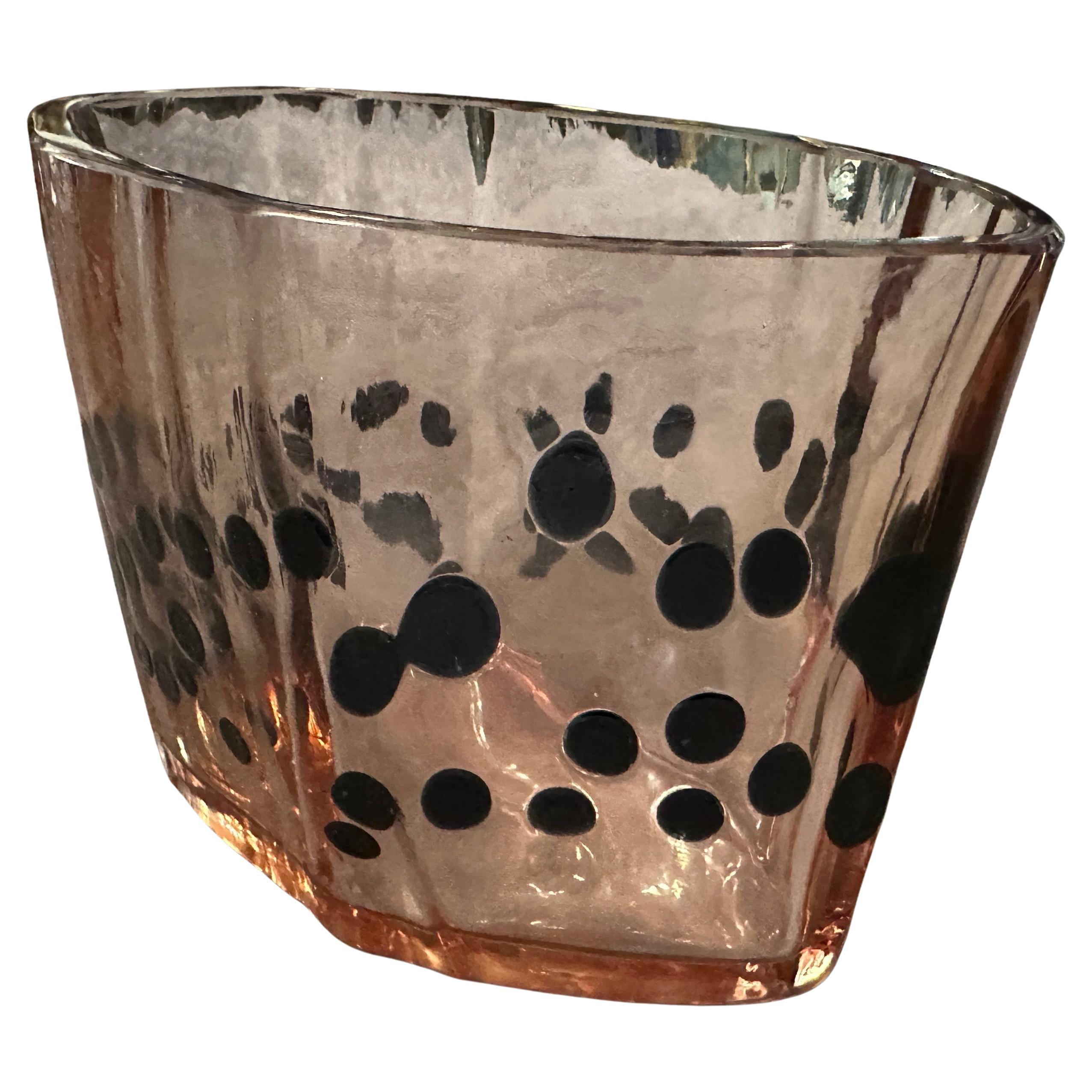 This 1960s Murano glass vase designed by Fulvio Bianconi for Venini, is a stunning example of Italian glass artistry, blending modernist aesthetics with traditional craftsmanship. Hand-blown Murano glass
A unique purple-hued glass base with bold