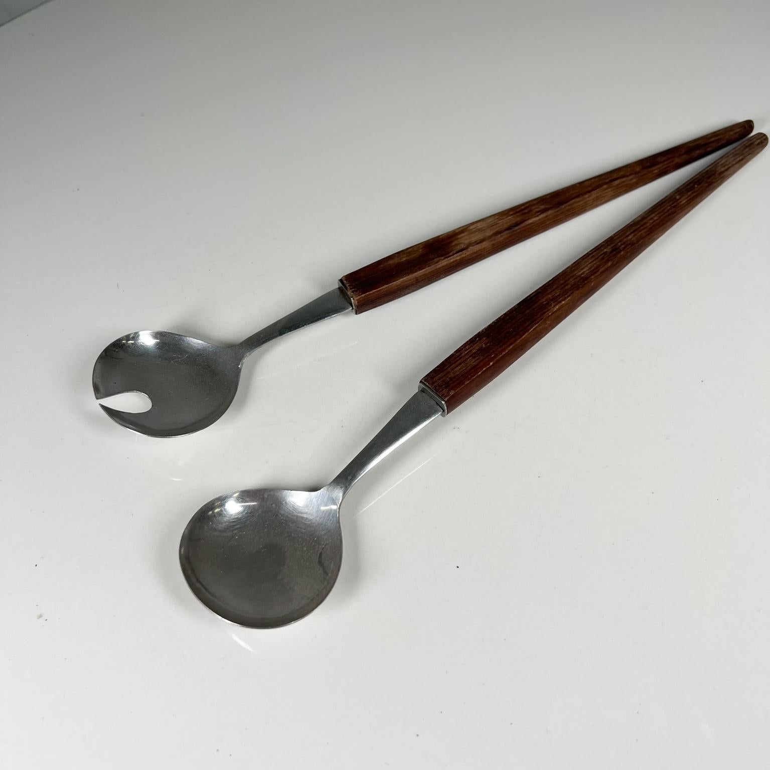 1960s Modern stainless steel wood salad serving set utensils Japan.
Stainless Steel Wood
Stamped
Measures: 12.88 x 2.38 x .5
Original vintage condition unrestored
See images provided.