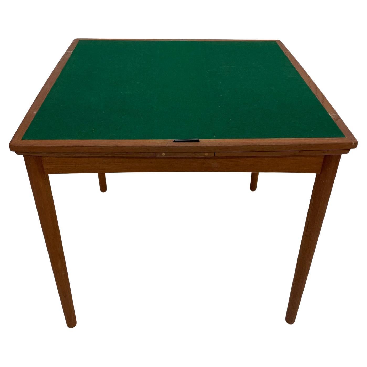 Game Table
Danish Modern Teakwood Game Table 1960s Denmark
Reversible top with green felt for gaming.
Attribution Brdr. Furbo stamped with Danish Control Seal. 
Measures: 56.5 fully extended x 31.5 D x 28.13 tall
Original preowned vintage