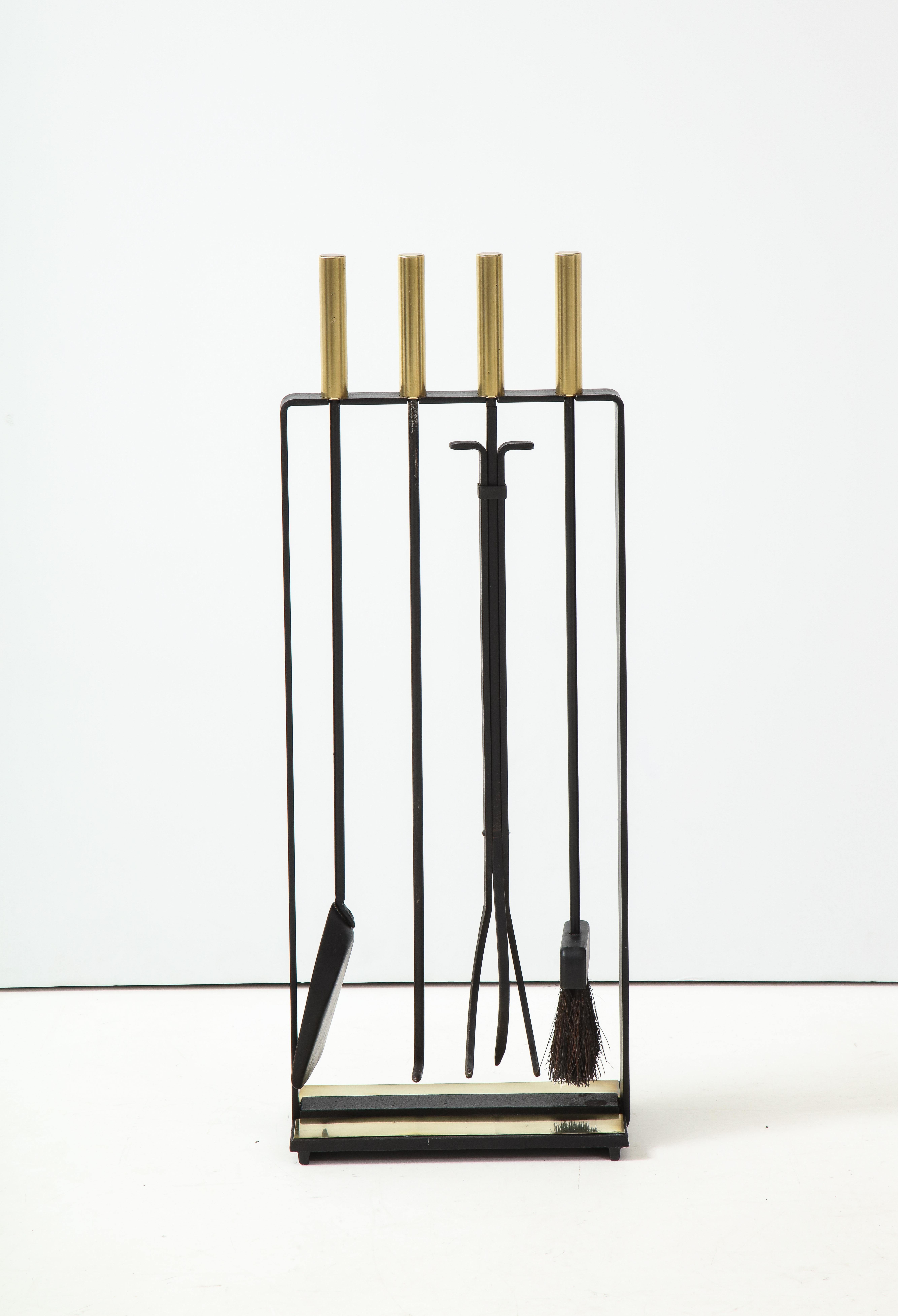 Stunning set of 1960's modernist brass and iron fireplace tools by Pilgrim, in vintage original condition with minor wear and patina due to age and use.