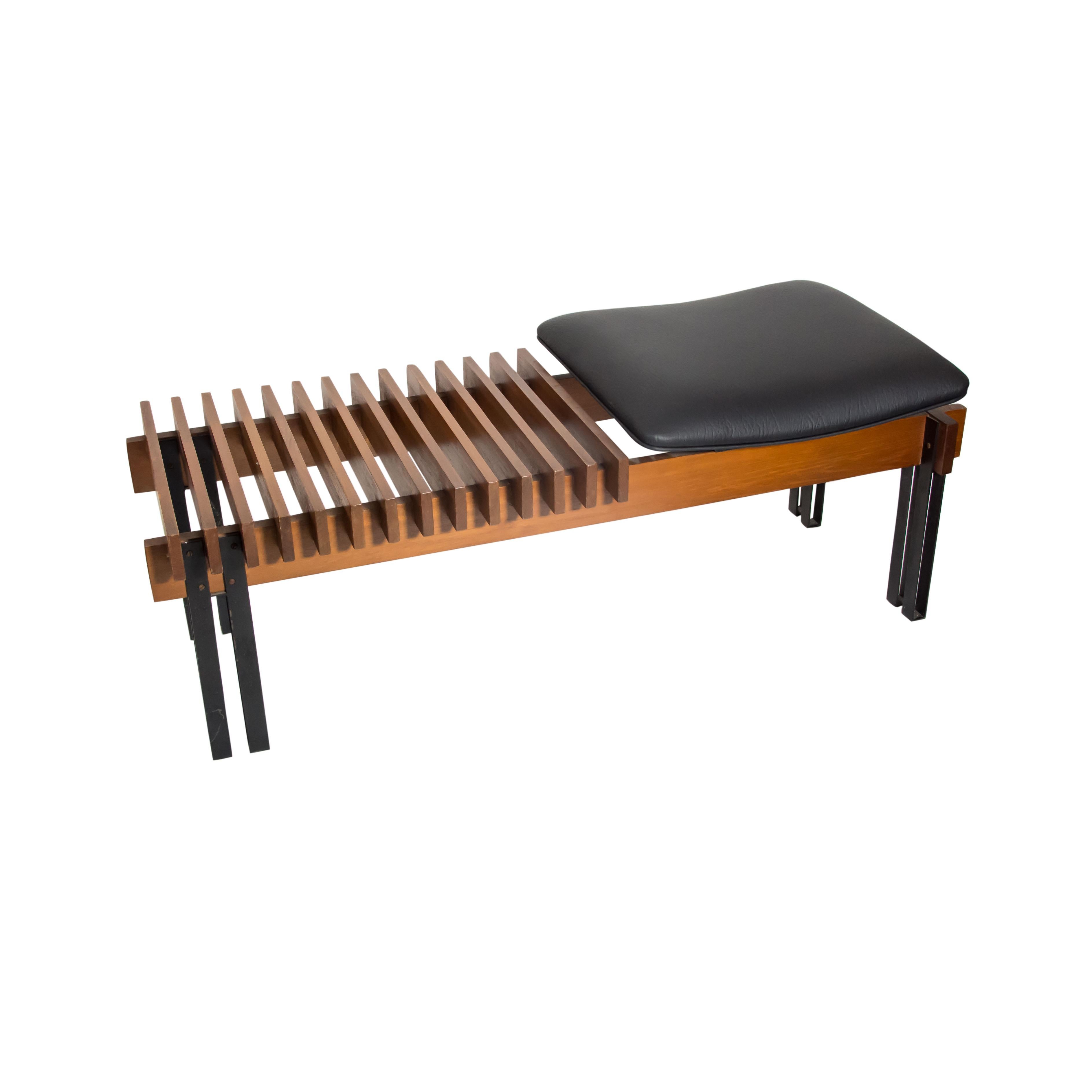 An outstanding pure Modernist bench, two tones of darker and lighter wood frame cleverly built up with a black leather upholstered seat, black enamelled metal feet, Italian design by Inge and Luciano Rubino circa 1960s Made in Italy
Very iconic and