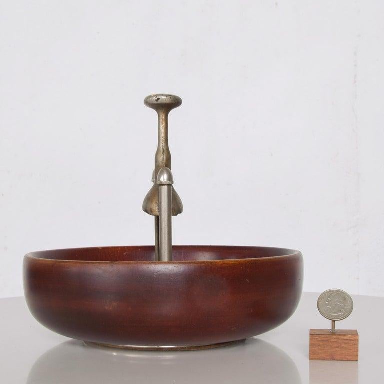 Nut Bowl
1960s Modernist Designed Elegant Cherry Wood Nut Bowl with built in nutcracker 
Fabulous modern purposeful midcentury design. Inscription reads PATENT APPLIED FOR
Measures: 7.5 Tall x 8.25 in diameter
Presents in original unrestored