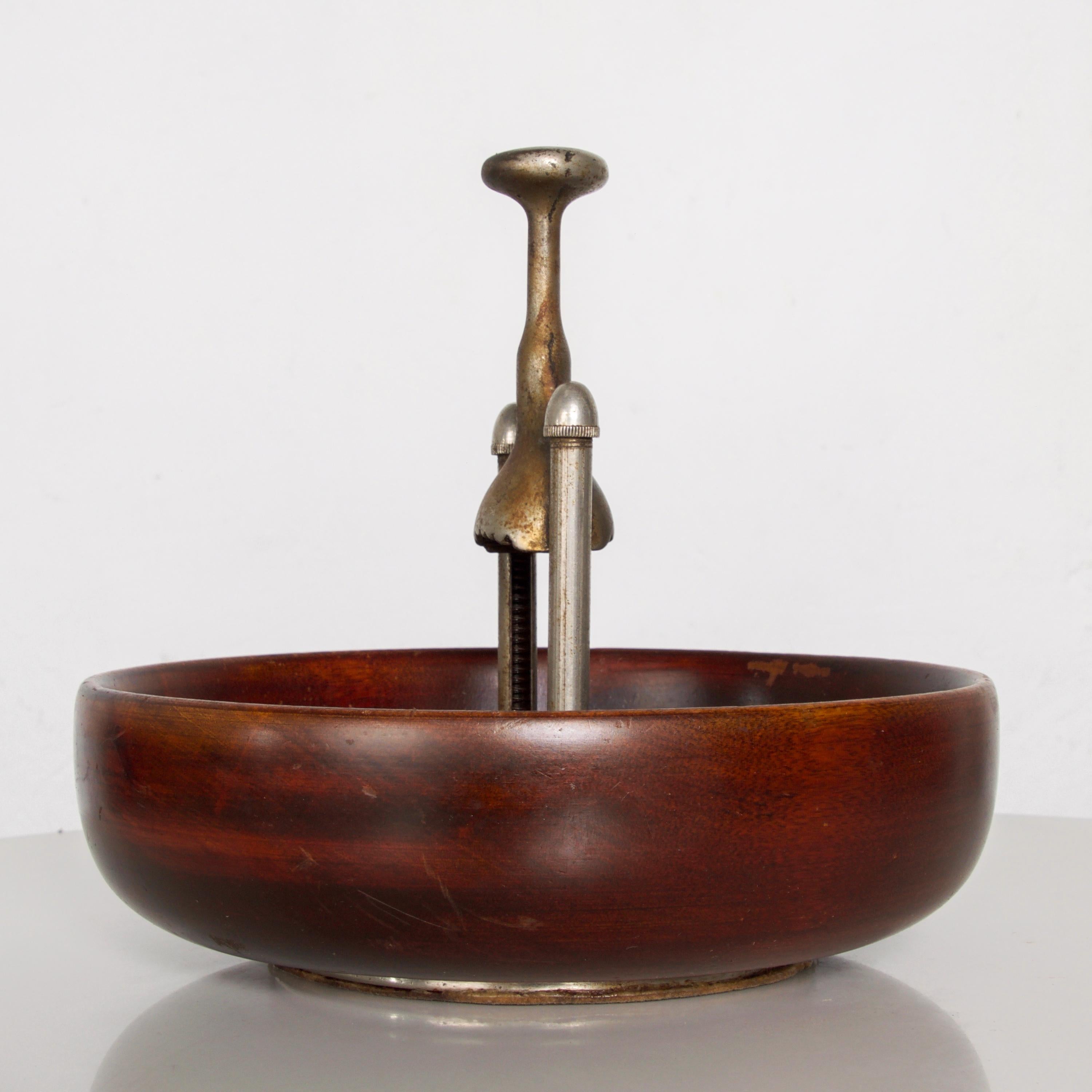 1960s modernist designed elegant cherrywood nut bowl with built in attached nutcracker
fabulous modern purposeful midcentury design. Inscription reads PATENT APPLIED FOR
Measures: 7 1/2
