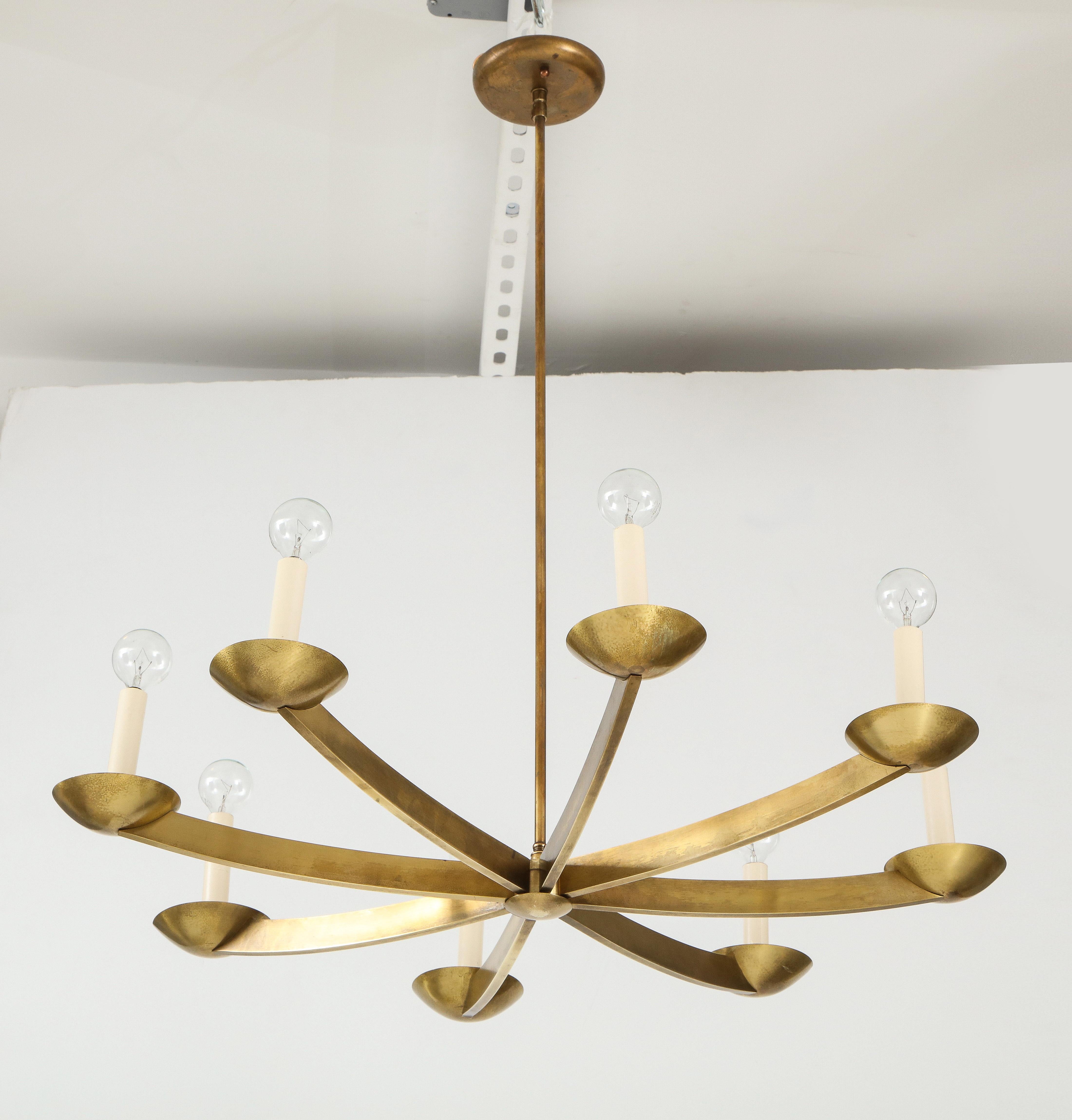 1960s modernist 8-arm brass Italian chandelier. Professionally rewired and ready to use, in vintage original condition with original patina the brass, the brass can be hand polish upon request.