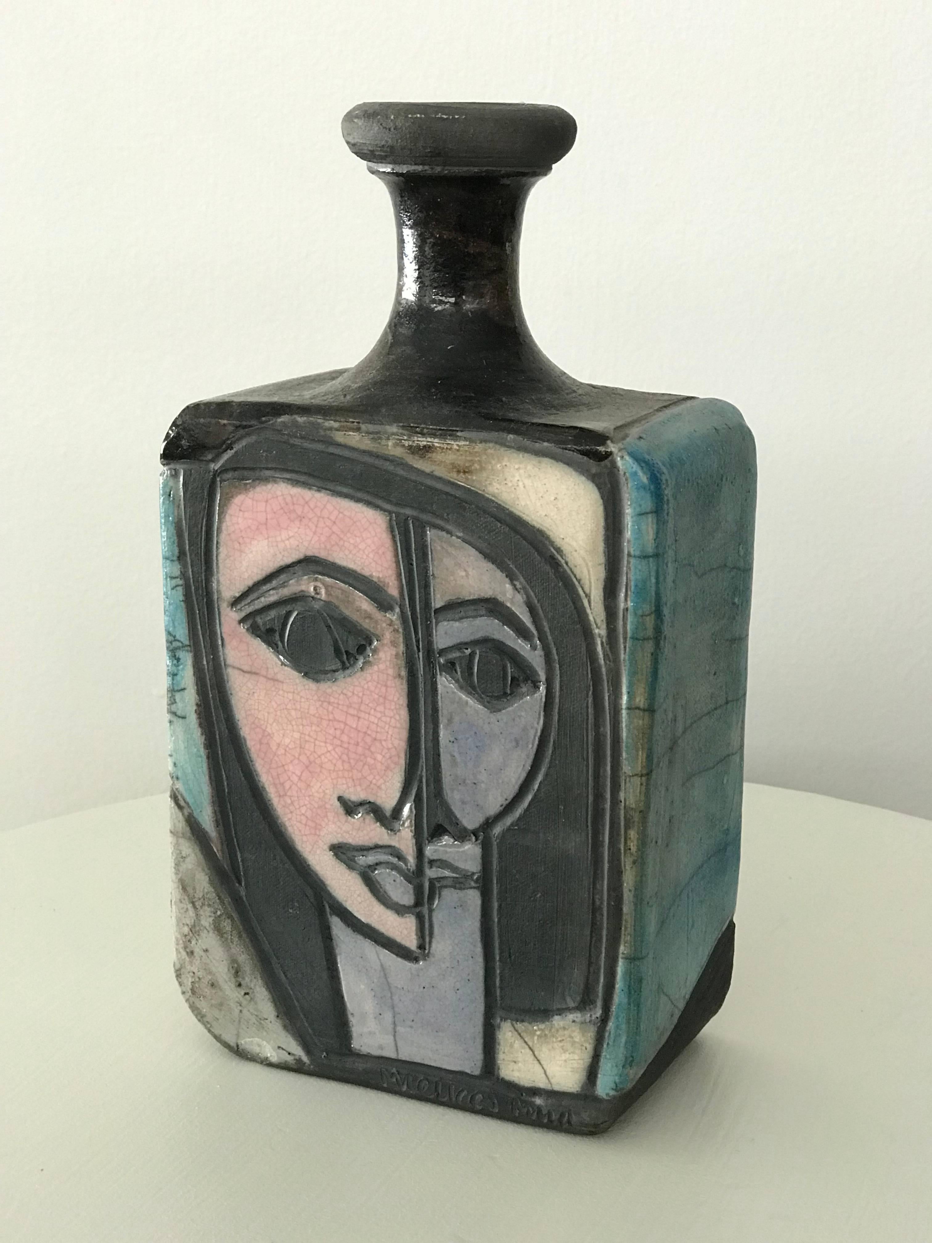 Eye-catching modernist/cubist/neoclassical raku vase/bottle/urn by published South Florida artist Linda Mielke, circa 1960s. No chips or cracks - very nice age appropriate crazing in the glaze. A marvellous piece. 

Measures: 9.75