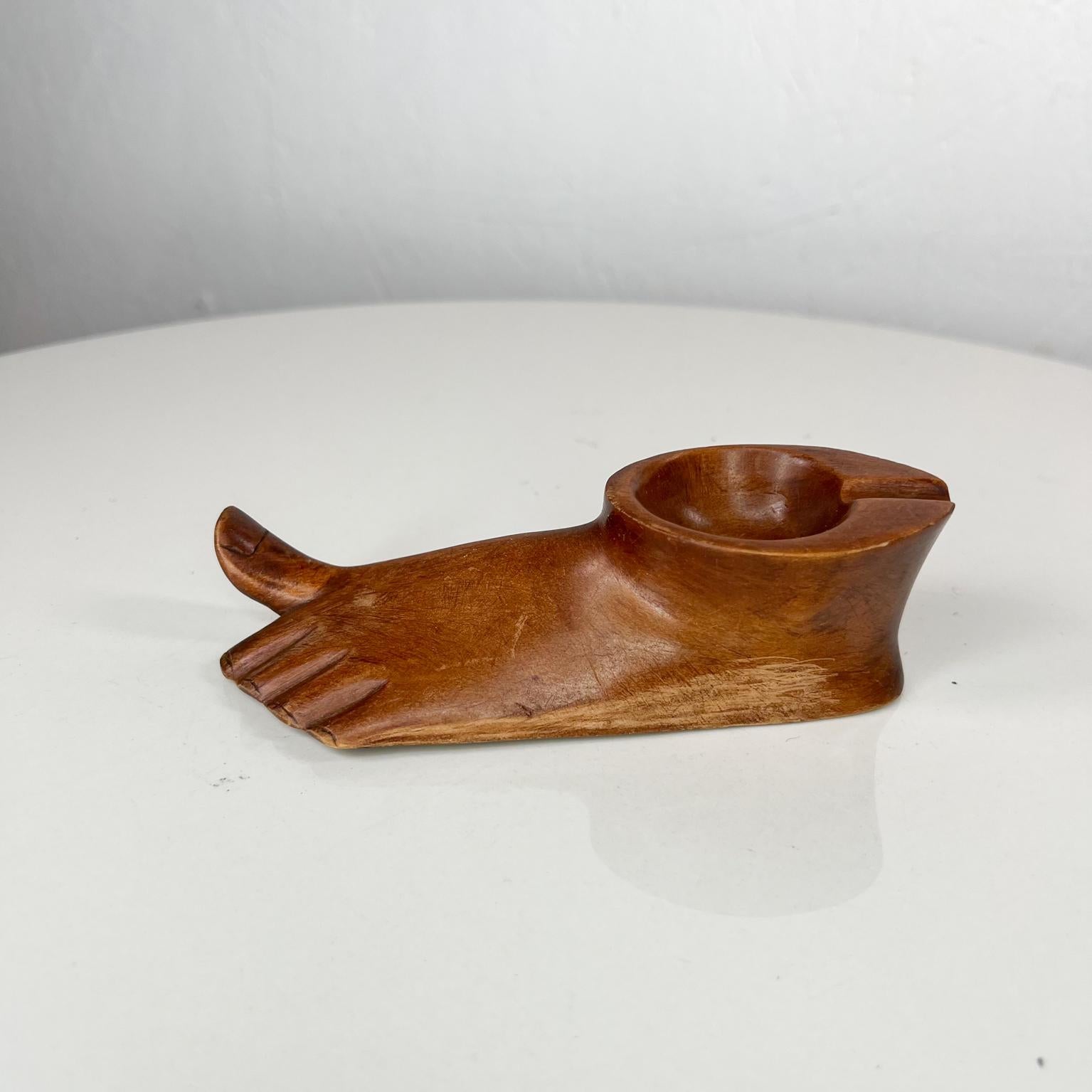 1960s Modernist ashtray pipe holder Hand Carved Wood Foot 
6 x 2.25 w x 1.88 tall
Unrestored original preowned vintage condition
See images provided.