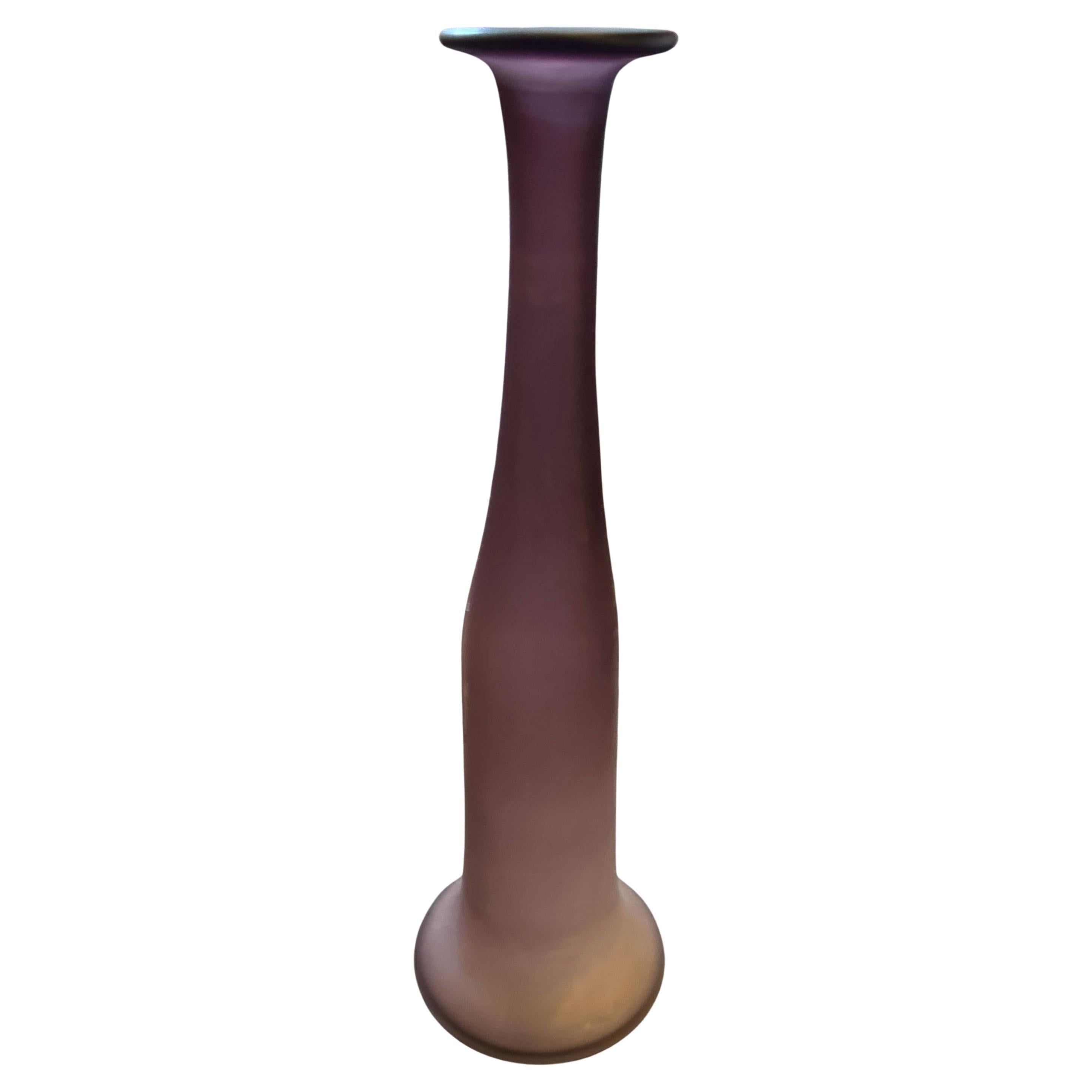 This elegant and striking modernist vase is a testament to the innovative artistry of the Cenedese glassworks on Murano. Dating from the 1960s, this piece features a sophisticated purple hue with a beautiful frosted 