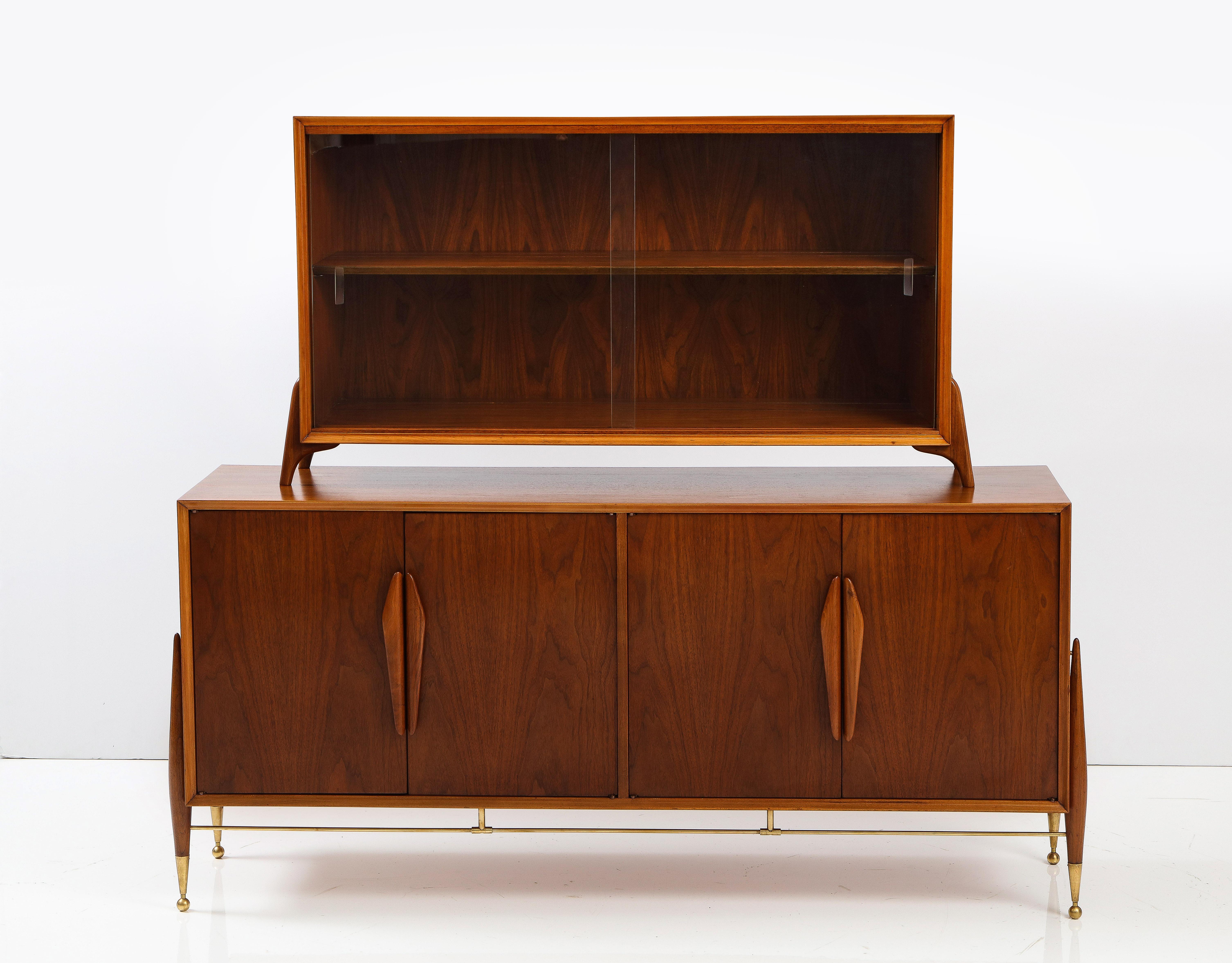 Stunning 1960's modernist sideboard with floating hutch top, with adjustable brass legs and solid brass stretcher, there is 4 holes on the top of the sideboard where the hutch sits, in vintage condition with minor wear and patina due to age and use,