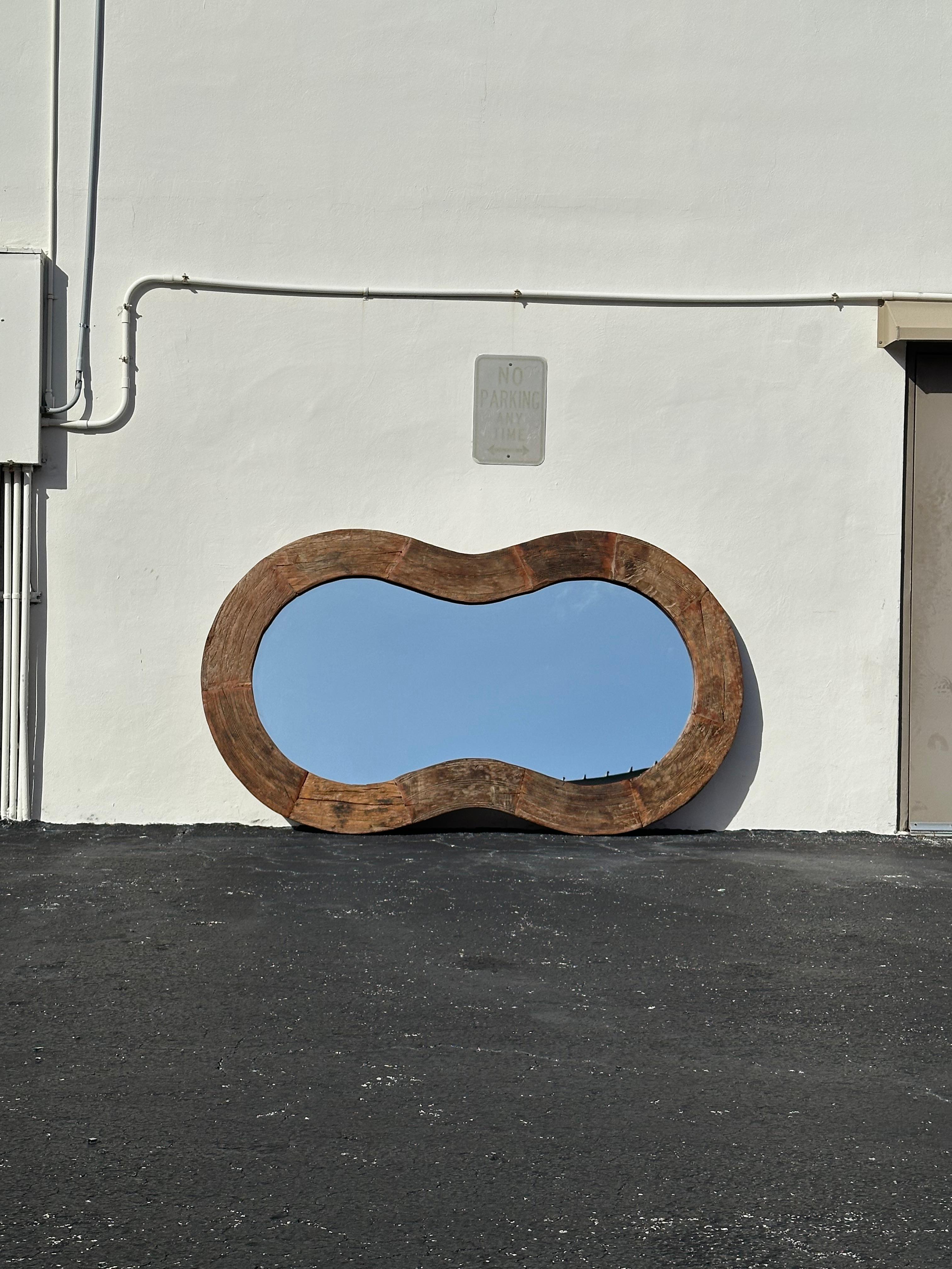 On offer on this occasion is one of the most stunning and rare biomorphic mirror you could hope to find. Outstanding design is exhibited throughout. The beautiful monumental mirror is statement piece and packed with personality!! Just look at the