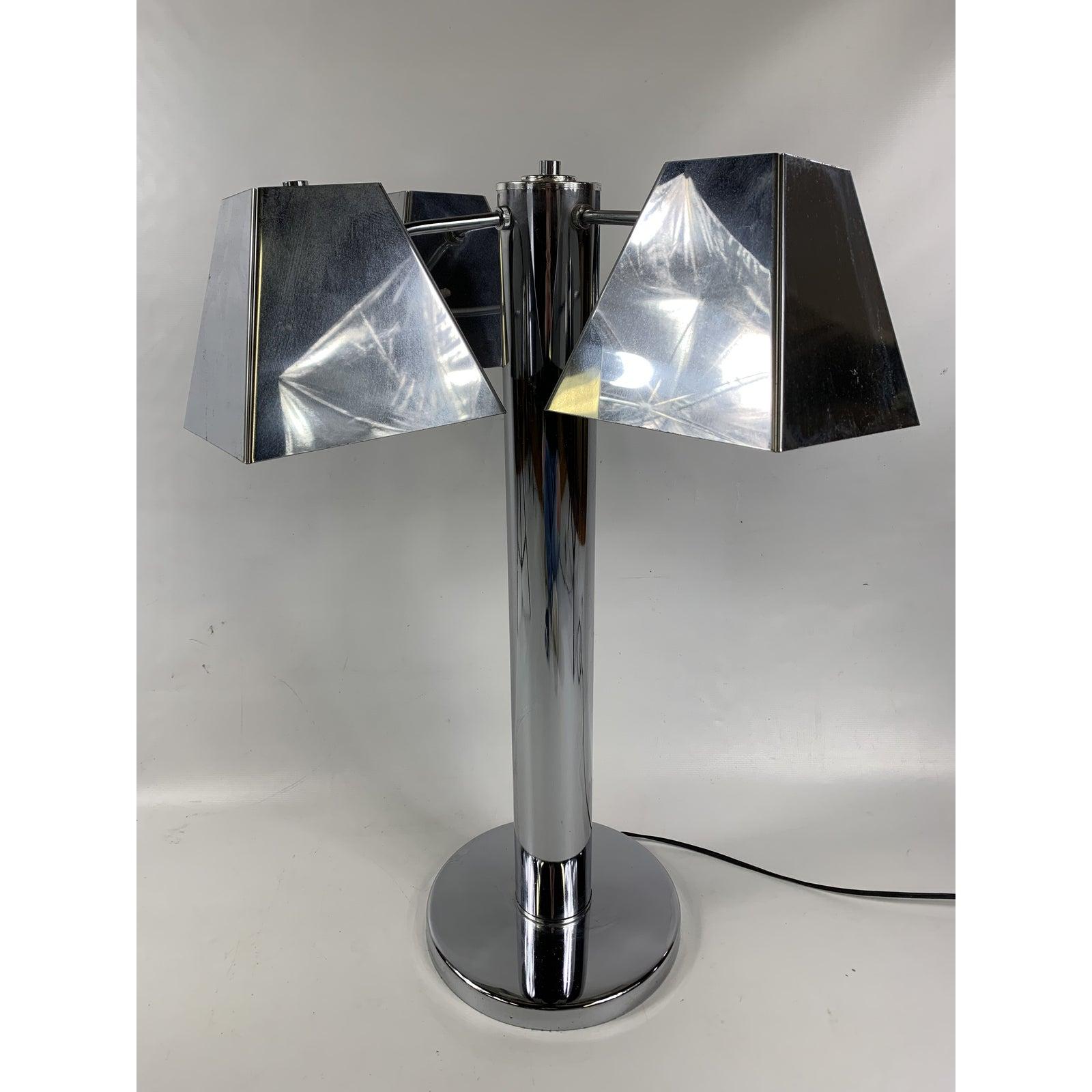 This is a very nice unique monumental chrome table lamp. The lamp is very large and very well made. Piece was made in the 1960s. Lamp takes 4 bulbs.