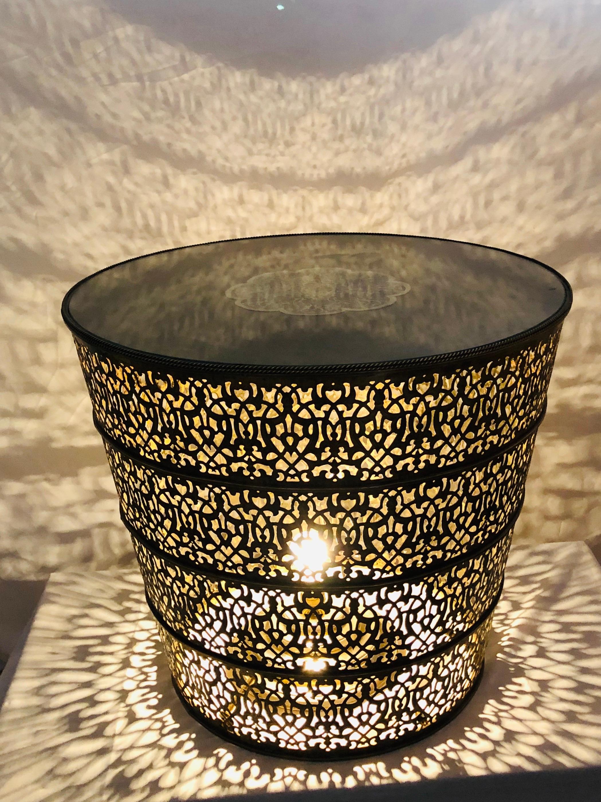 A majestic all brass round center table, lamp table or side table. The handmade 1960s Moorish style table features amazing intricate design. Three bulbs can be wired from inside the table, turning it into a lighted table.
Can be wired upon request.