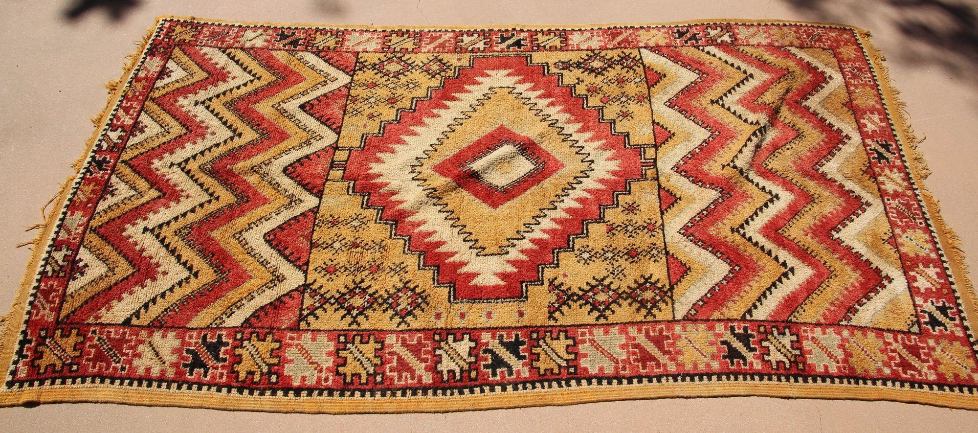 1960s Moroccan authentic Berber Rug Orange Yellow and Ivory.For centuries the tribal people of Morocco's Atlas Mountains have passed down the delicate art of rug-weaving. In Northern Africa rugs are not only a practical asset to the home, they are