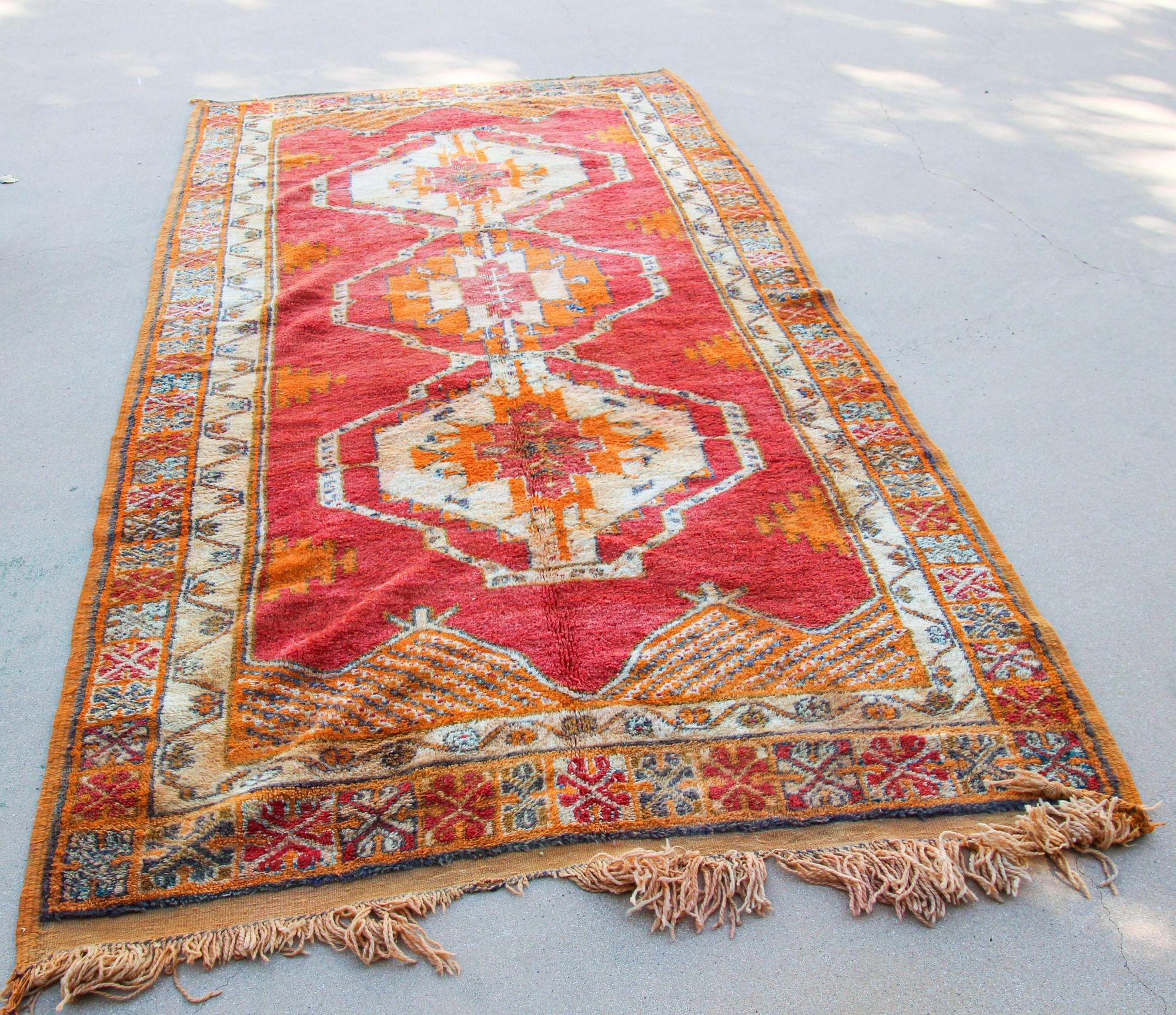1960s Moroccan authentic Berber rug, burnt orange cors.For centuries the tribal people of Morocco's Atlas Mountains have passed down the delicate art of rug-weaving. In Northern Africa rugs are not only a practical asset to the home, they are an