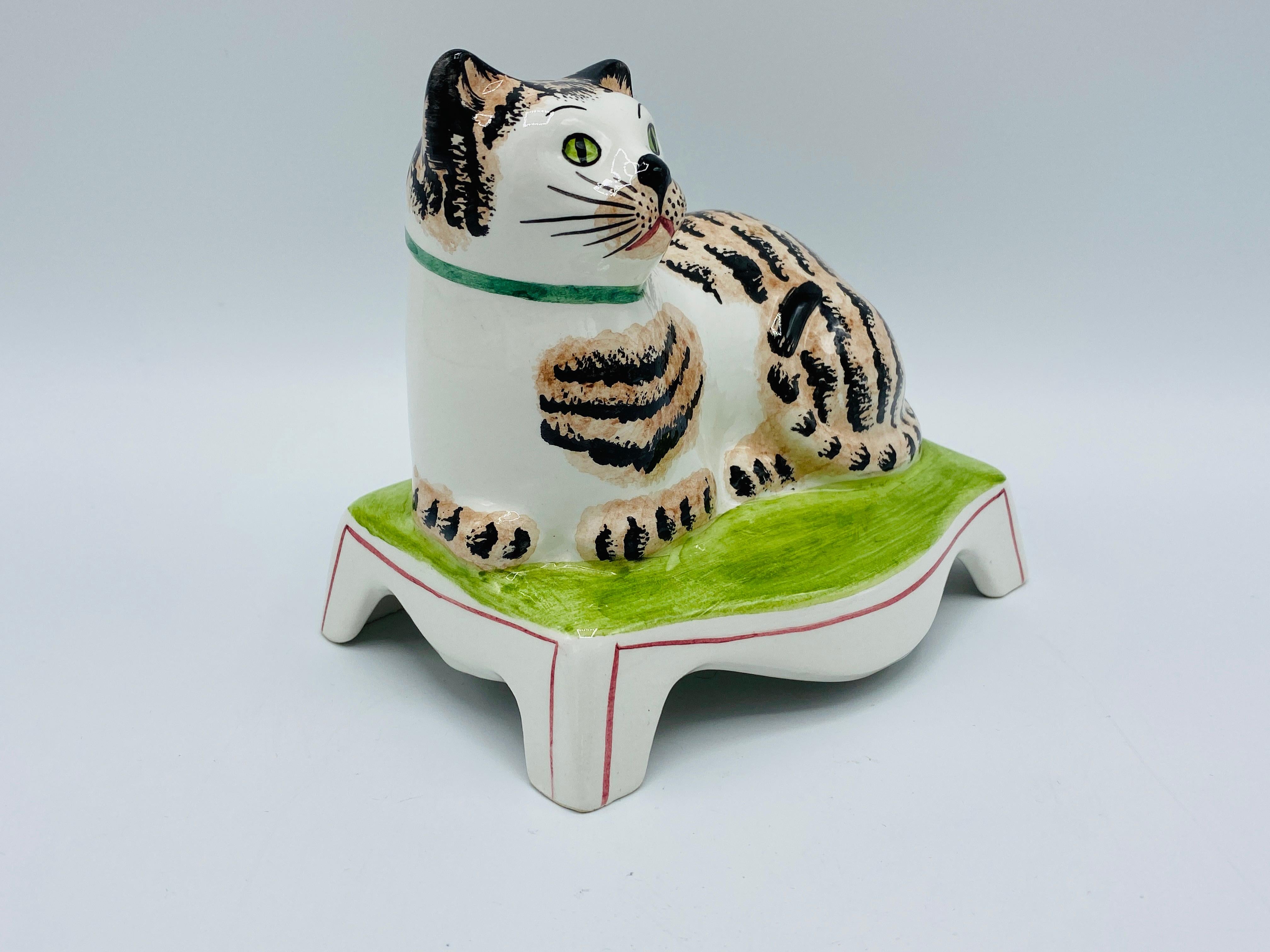 Listed is a fun and unusual, Mottahedeh ceramic cat sculpture, circa 1960s Italian. Marked on underside with an original Mottahedeh tag and a hand painted 'Italy' marking.