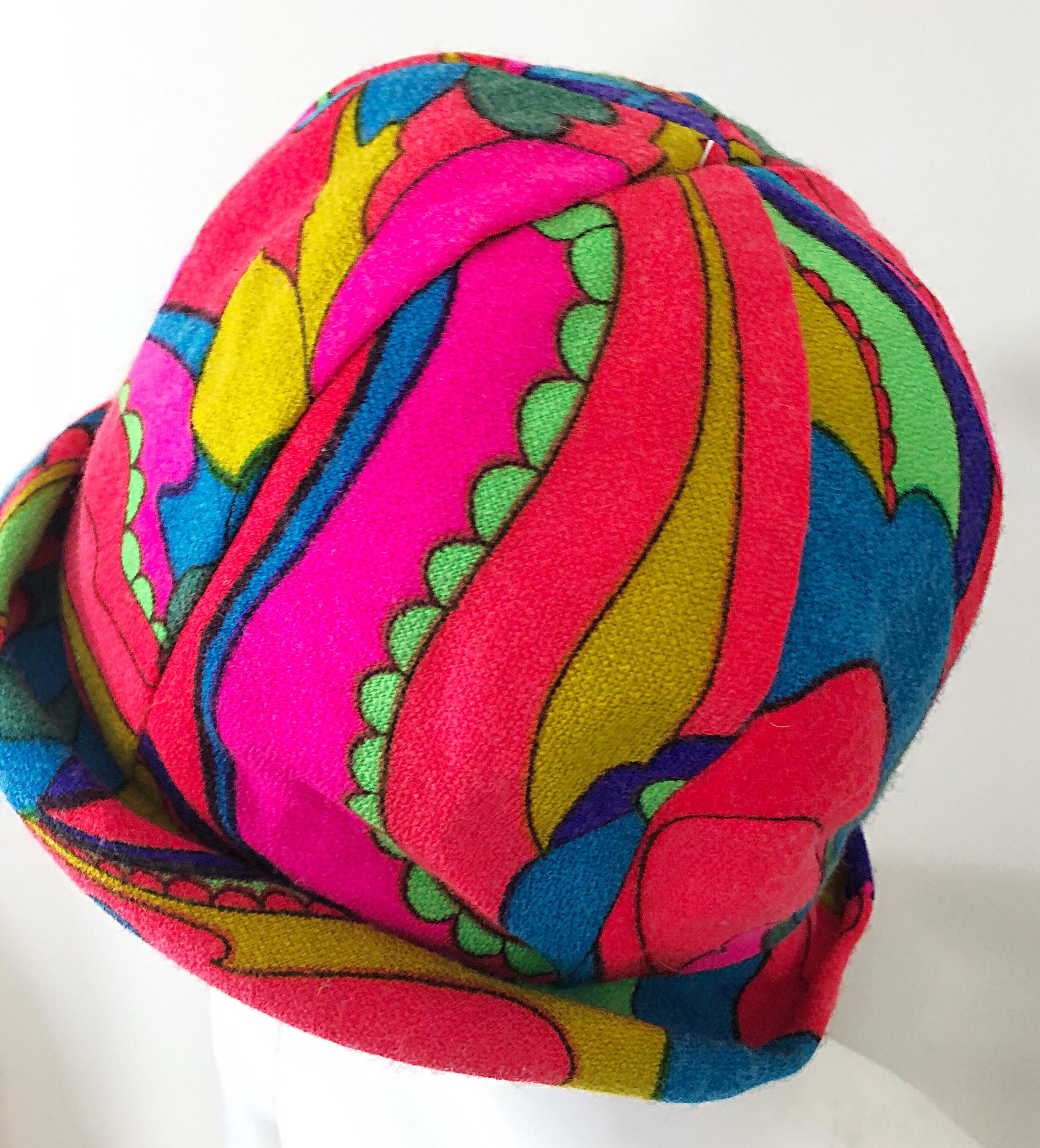 This 1960s MR. MARTIN cloche hat is the epitome of the 60s! Vibrant colors of hot pink, blue, green, orange, and yellow throughout. Soft lightweight virgin wool is perfect for any time of year, and is lined. Great with jeans, or a dress. In great