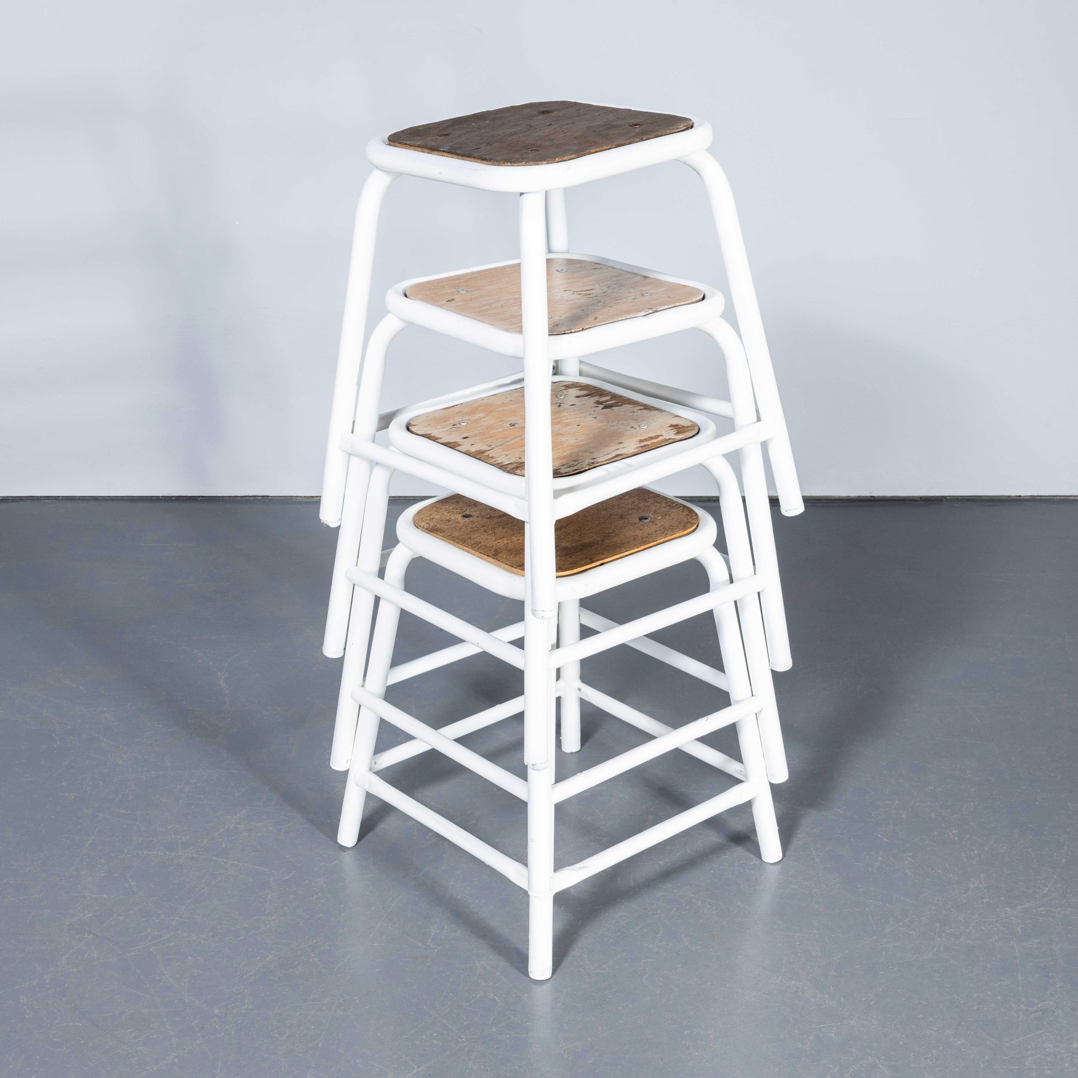 1960's Mullca low stacking stool - White - Set Of Four. 
Sourced from the French Army these stools were used in field operations as bedside tables/stools. In 1947 Robert Muller and Gaston Cavaillon created the company that went on to develop