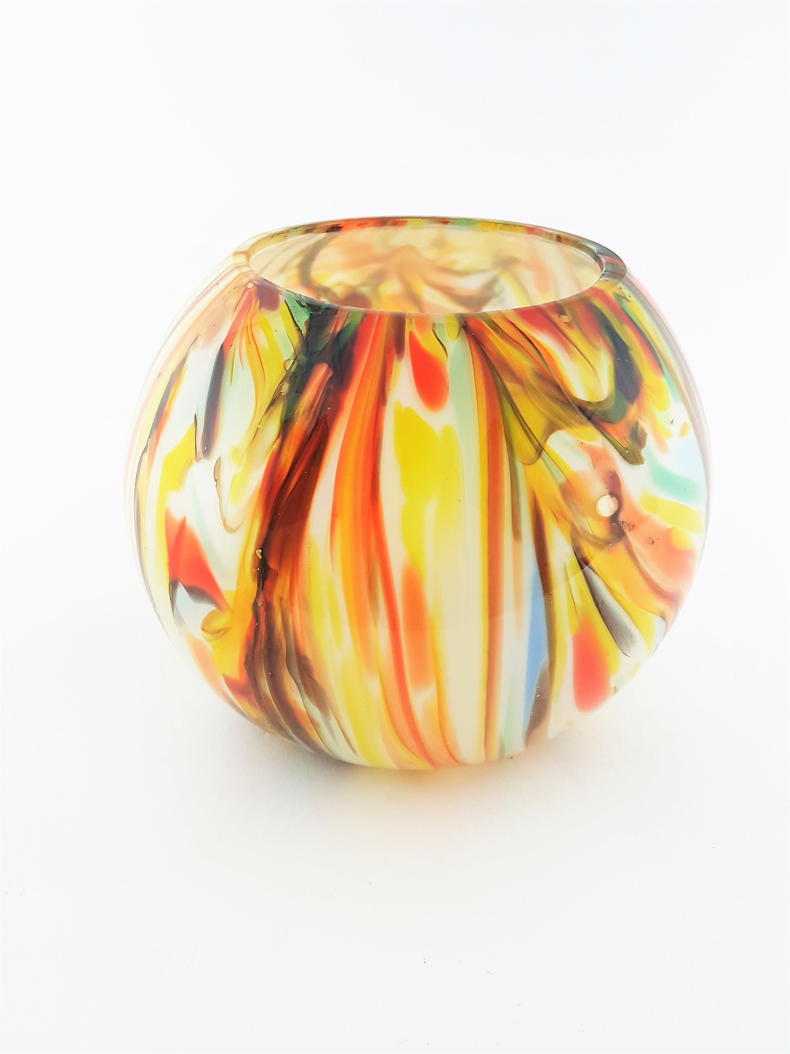 Colorful handblown Murano glass globe vase made in opaline glass and clear glass with a beautiful latticino decoration in warm and pastel tones.
The vase is in very good condition, Italy, 1950-1960.

Avaliable a huge collection of Murano glass