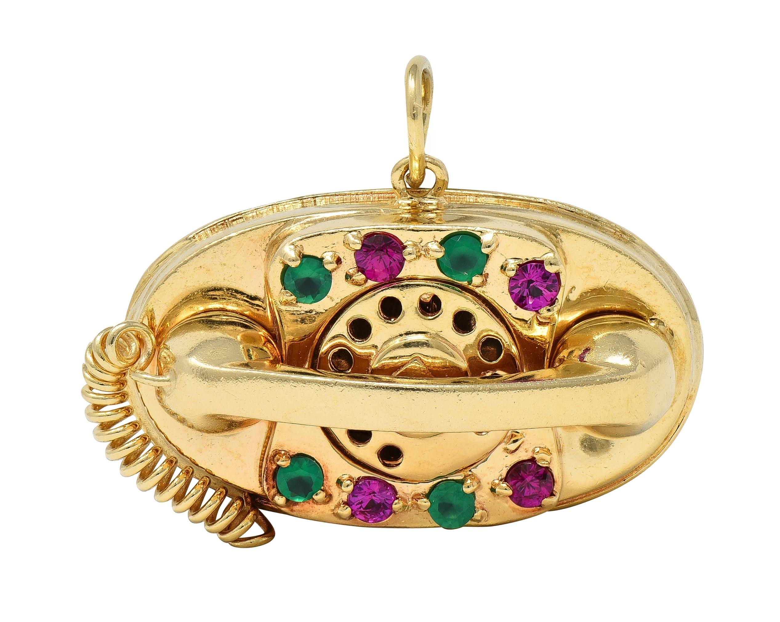 Designed as a fully dimensional rotary phone centering a rotary dial
Accented by coiled cord and bead set chrysoprase and rubies
Collectively measuring 3.0 mm round - alternating in pattern
Chrysoprase is transparent vibrant bluish green in