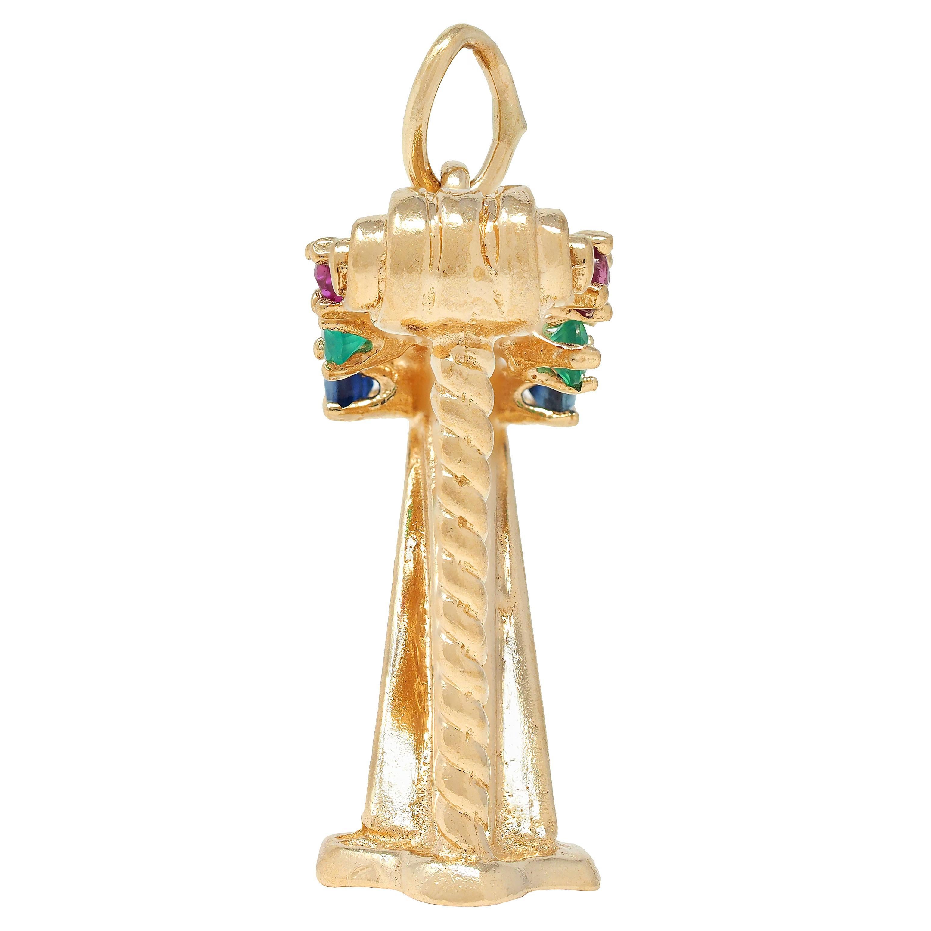 Designed as a dimensional yellow gold harp instrument
Featuring gold wire strings and twisted cable column
Accented by round cut ruby, sapphire, and chrysoprase
Prong set and each measuring 2.0 mm round
Transparent red, dark blue, and vibrant bluish