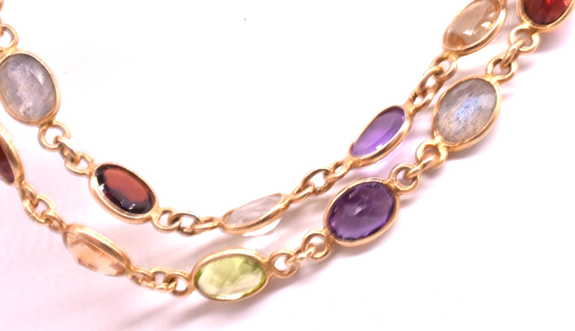 Lightweight and fun necklace made up of amethysts, garnets, peridot, rock crystal and citrine in a  gold plated setting. The necklace is great worn singly or doubled or looped three times around the neck for a sophisticated look.  The necklace is 35