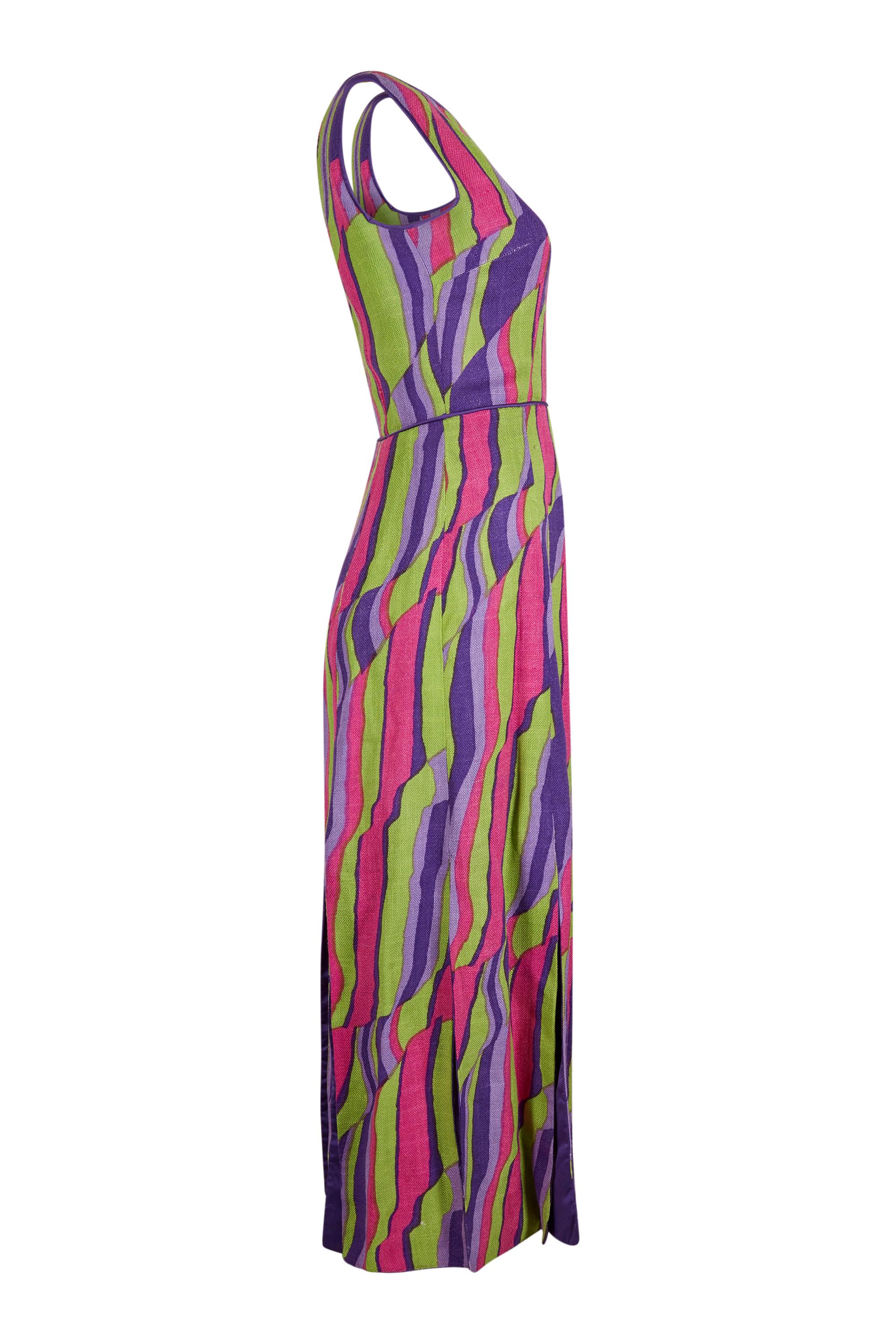 This dynamic 1960s linen and silk abstract print maxi dress is unlabelled, although its magnificent construction reveals that it is demi-couture and probably made by a leading designer of the era. The linen overlay features a striking abstract