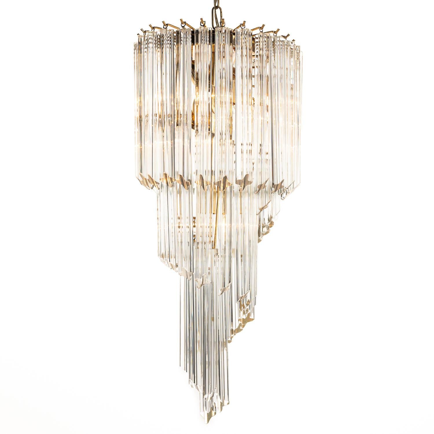 Looking for lighting that makes an impression? This is the one. From the practical, chunky chain and canopy, underneath we get to a spectacular arrangement of hanging crystal-glass cross-shaped tubes, formed into a mesmerising spiral to a single