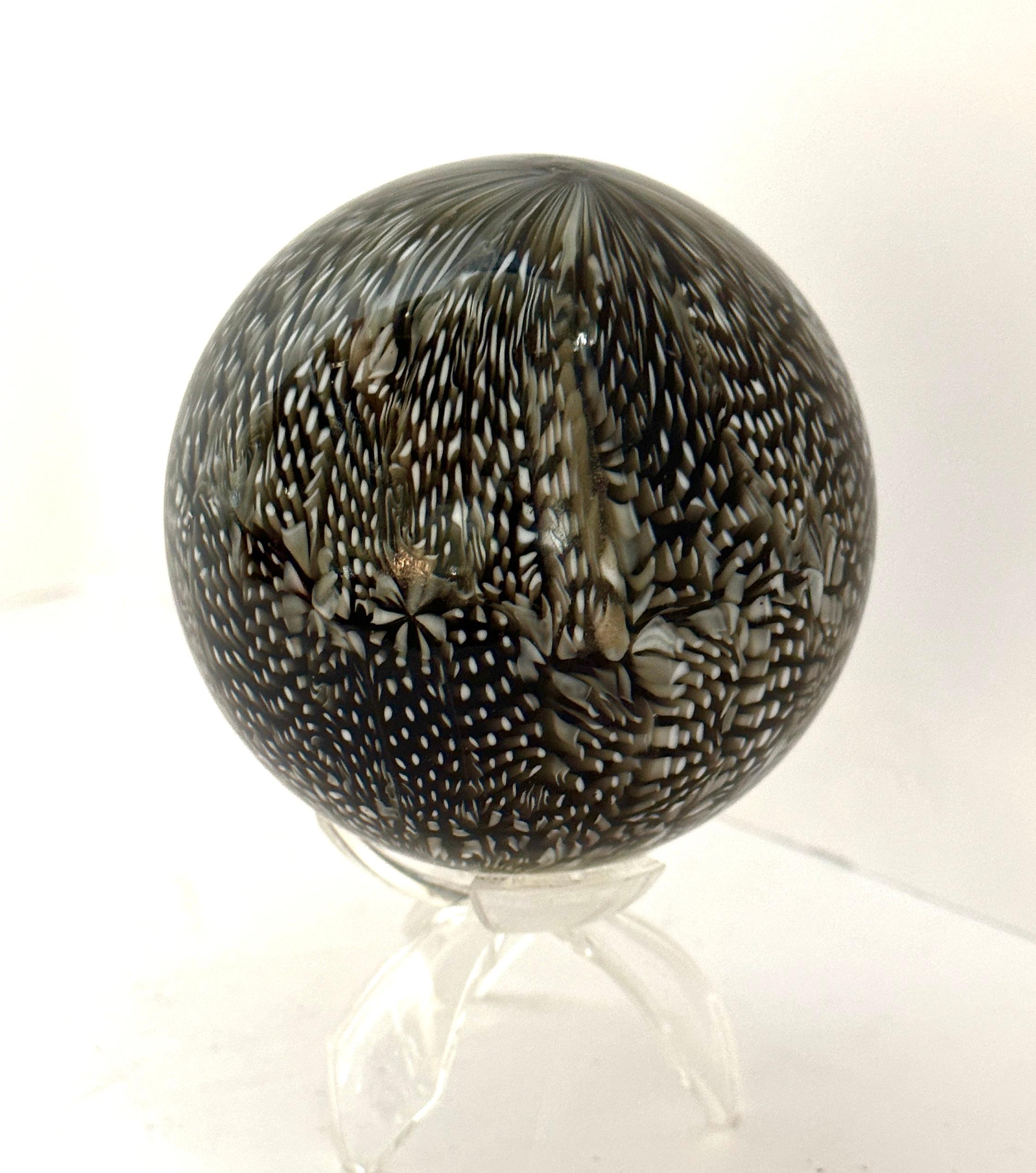 Wonderful Murrine ball by the noted Venini artist Ludovico Diaz de Santillana. It dates from the 1960’s and is signed on the bottom Venini Italia. Lovely shades of brown and white. In good condition with no chips or cracks. Ludovico was married to