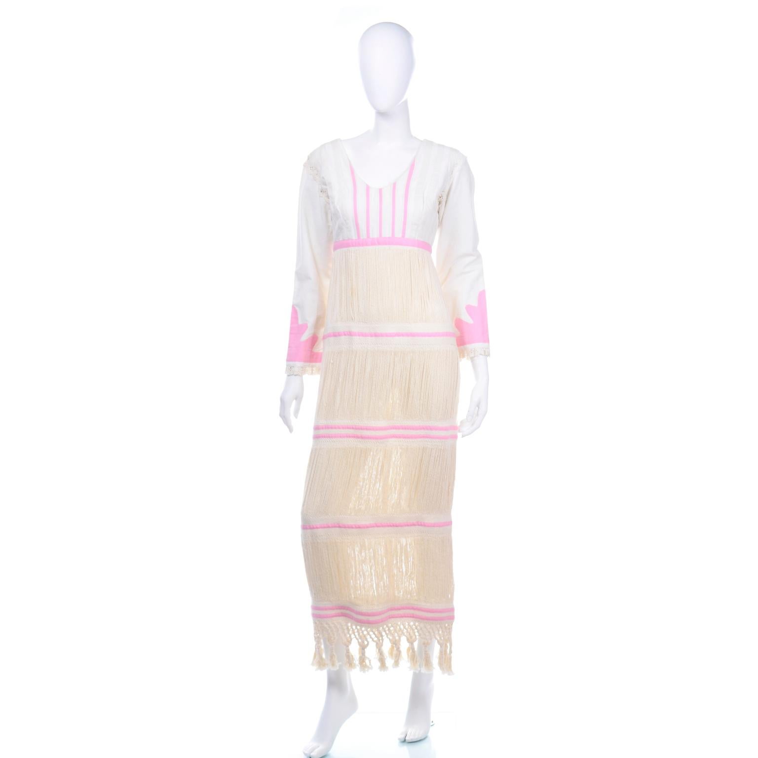 This one of a kind vintage dress came from an estate of collectible higher end ethnic folk clothing from Mexico, Central America and South America from the 1960's and 1970s. We have never seen anything quite like this particular vintage dress! The