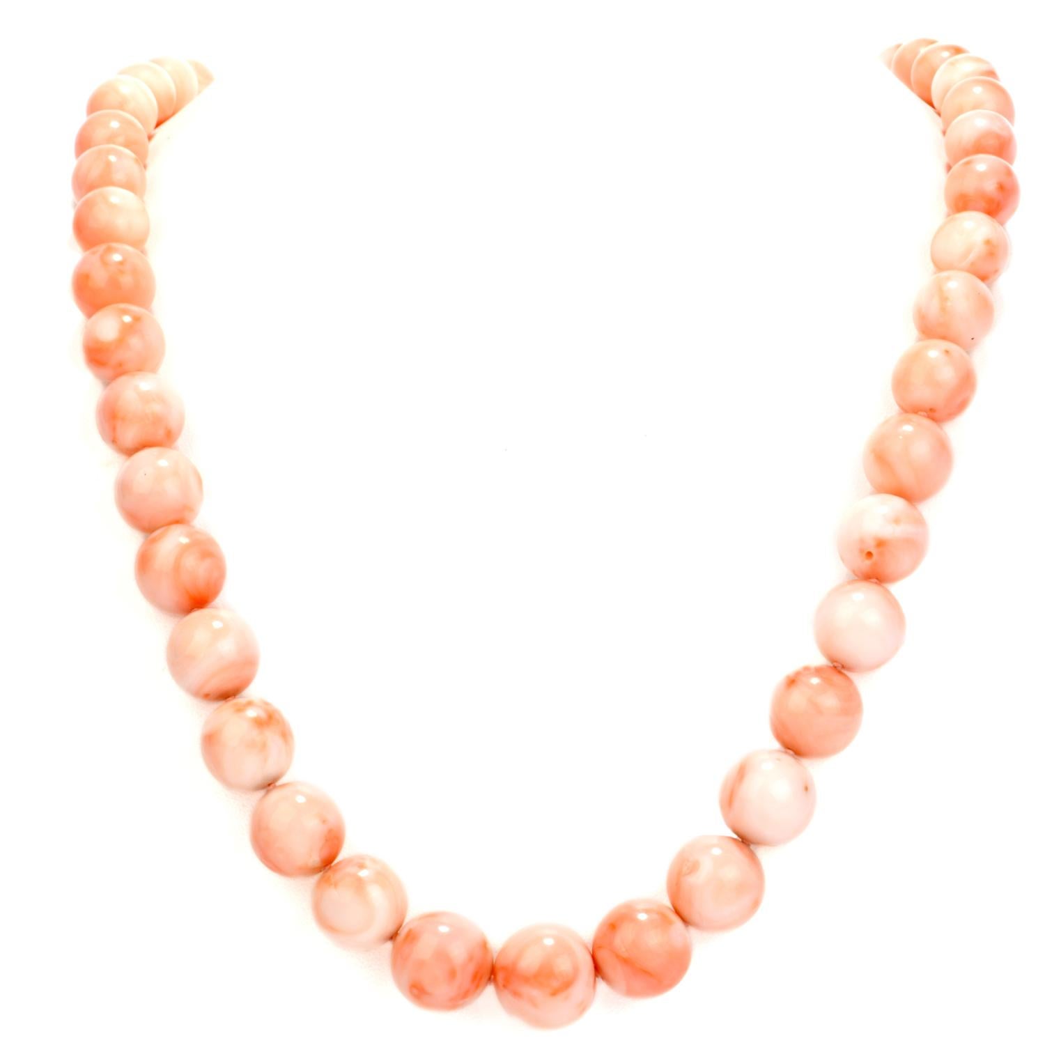 Indulge in this significant natural Coral 15 mm Graduated Necklace.  Each large coral graduated bead ranges from15-10 mm in width.  The necklace spans 25 inches long around the neckline.  The marbled pattern on each bead will send you to bliss with