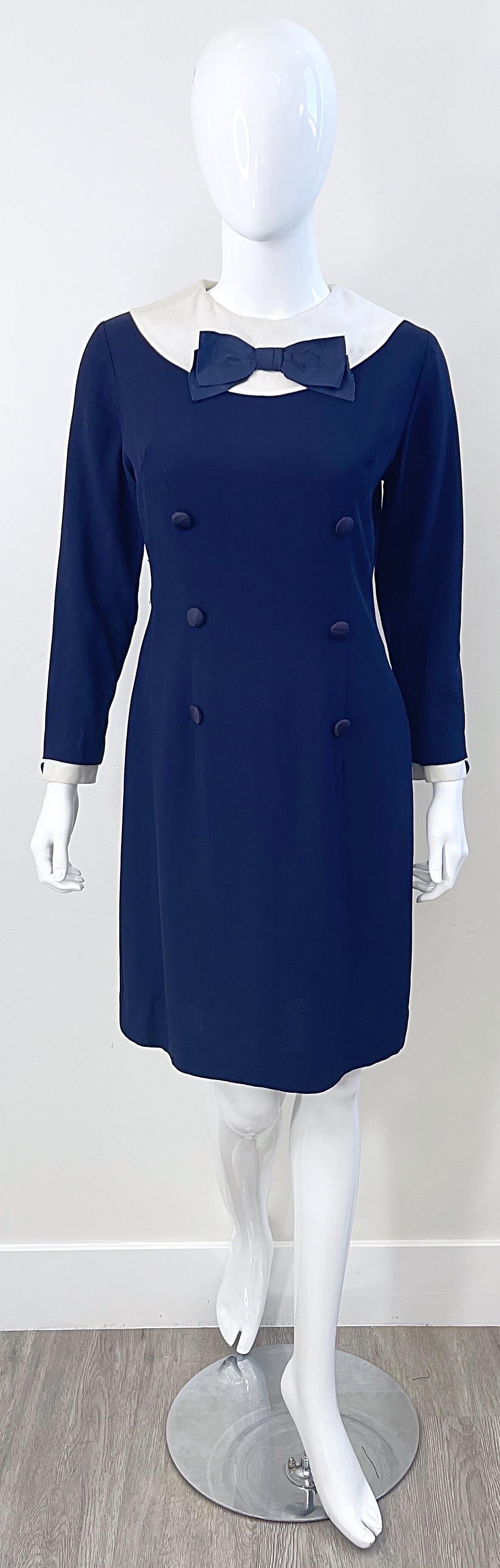 Chic 1960s navy blue and white nautical long sleeve dress ! Features a soft blended fabric of silk and rayon. Silk bow at top center bust. Fully lined. Full metal zipper up the back with hook-and-eye closure.
Dress has been professionally cleaned,