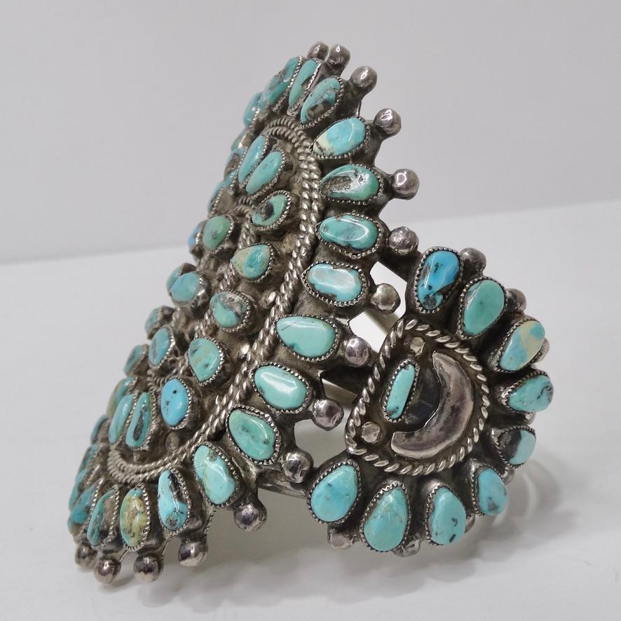 Beautiful Navajo sterling silver and turquoise arm cuff circa 1960s! This piece is so timeless and unique! Featuring a cluster of turquoise stones accompanied by silver engravings forming a flower-like shape. Match this to a vintage turquoise ring,