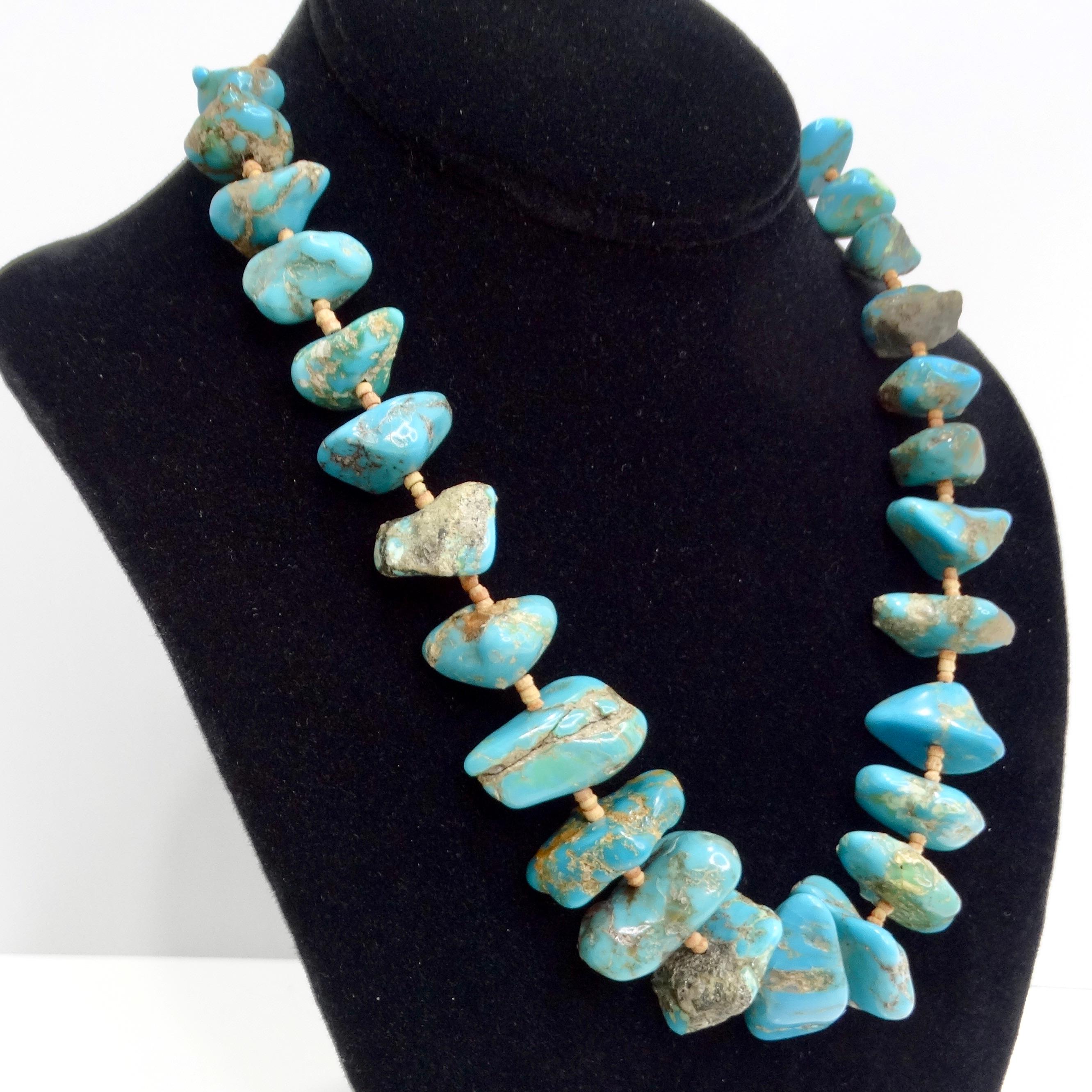 Introducing the 1960s Navajo Turquoise Necklace, a striking vintage piece that captures the essence of Navajo craftsmanship and bold Southwestern style. This beautiful necklace features vibrant blue turquoise stones, each with unique patterns and