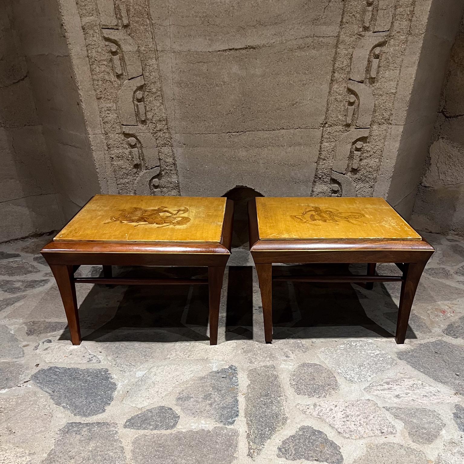 1960s Side tables in solid mahogany wood and goatskin Made in Mexico 
Postmodern design with a neoclassical flair -clean modern lines. 
Hand painted Roman motif. 
The tables are unsigned. The work is consistent with the pieces produced by Maria