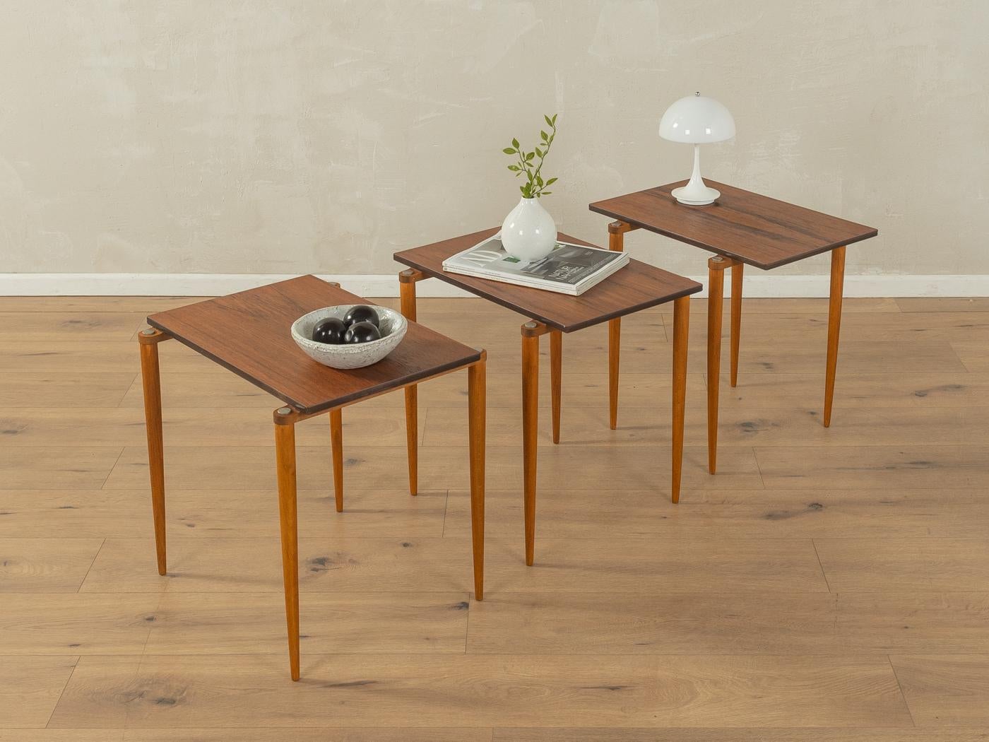 Very rare nesting tables from the 1960s. High-quality solid beech frame and table top in walnut veneer.

Quality Features:
very good workmanship
high-quality materials
Made in Germany, manufacturer: Opal Möbel (Branding on the frame)