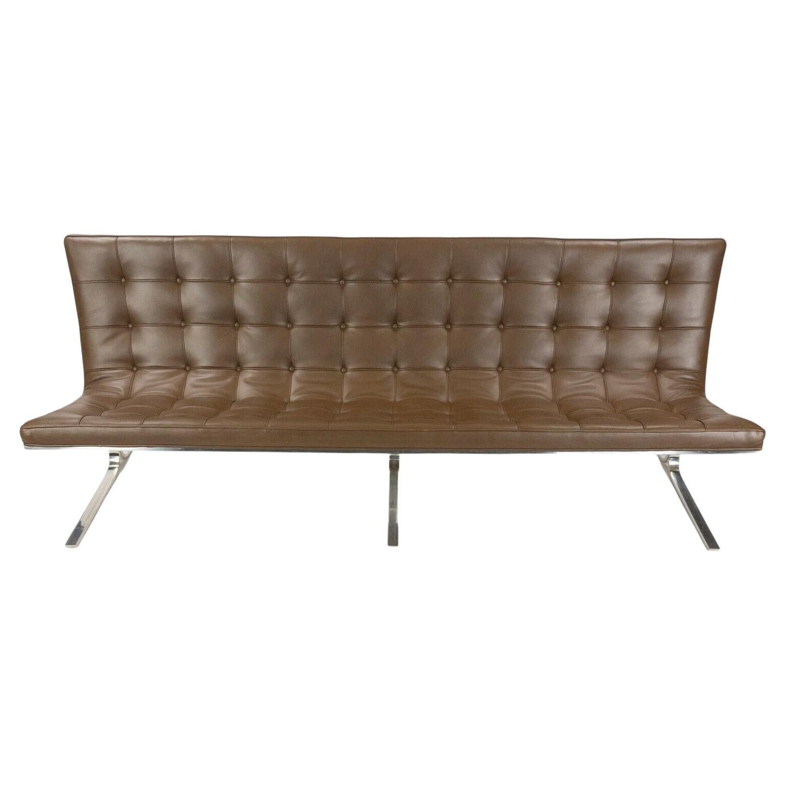 Listed for sale is a notable and very rare Nicos Zographos CH28 ribbon three-seater sofa in brown leather, produced by Nicos Zographos Designs Inc. The custom fabricate and polished stainless steel legs have a nice patina and the leather is clean