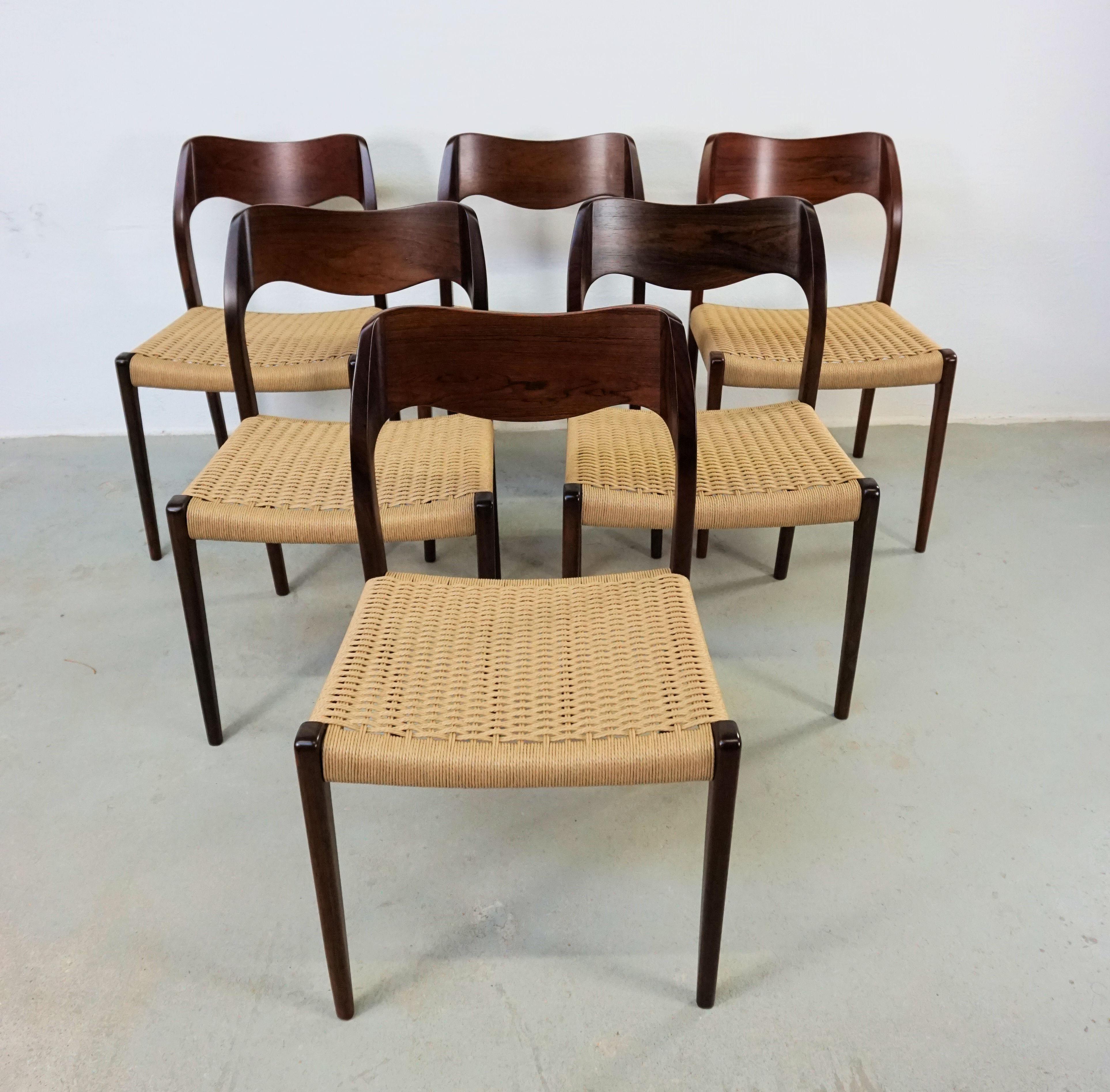 1960s Niels Otto Møller six rosewood dining chairs with new paper cord seats designed by Niels Otto Møller in 1951.

The chairs feature a solid frame and veneered backrest in rosewood designed with straight lined legs and an elegant organic shaped