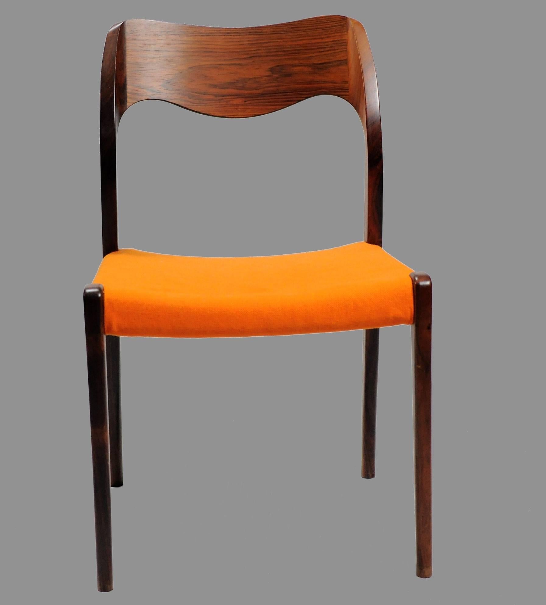 Set of 12 model 71 rosewood dining chairs designed by Niels Otto Møller in 1951.

The chairs feature a solid frame and back rest in rosewood designed with straight lined legs and an elegant organic shaped backrest with the soft lines and curves that