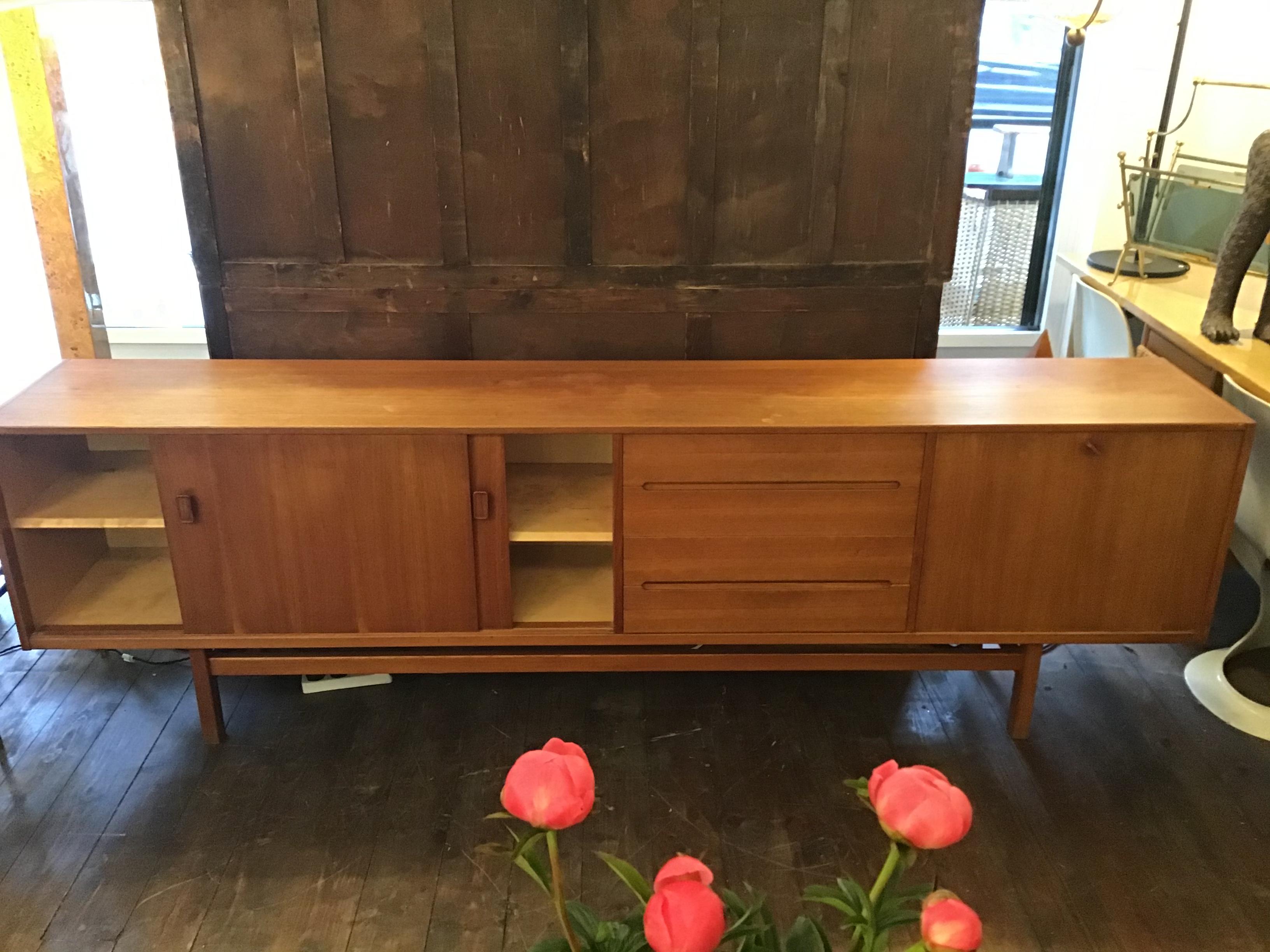 Large ’Gigant’ Nils Jonsson sideboard for Troeds Bjärnum of Sweden. Very modernist minimal look with superb attention to details featuring sleek recessed handles at the bottom of the drawers and cabinets. Great storage capacity including a bank of