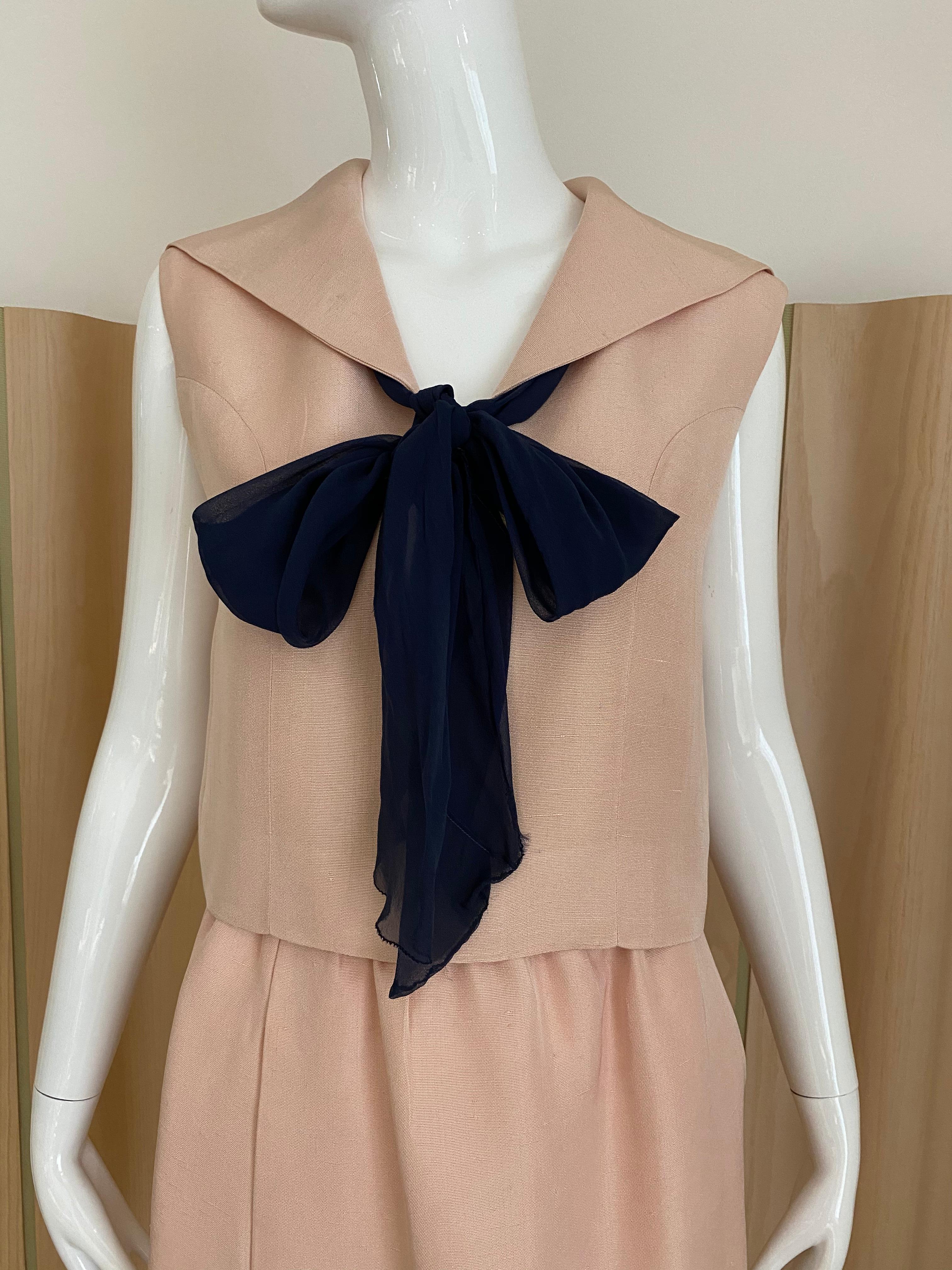 Chic vintage Norell - Tassel silk blouse in light peach color. Sleeveless top with black silk bow. Fitted Skirt.
Fit size 2/4
Blouse measurement: 
Skirt measurement: Waist 26”
** flaws on the skirt ( see image)