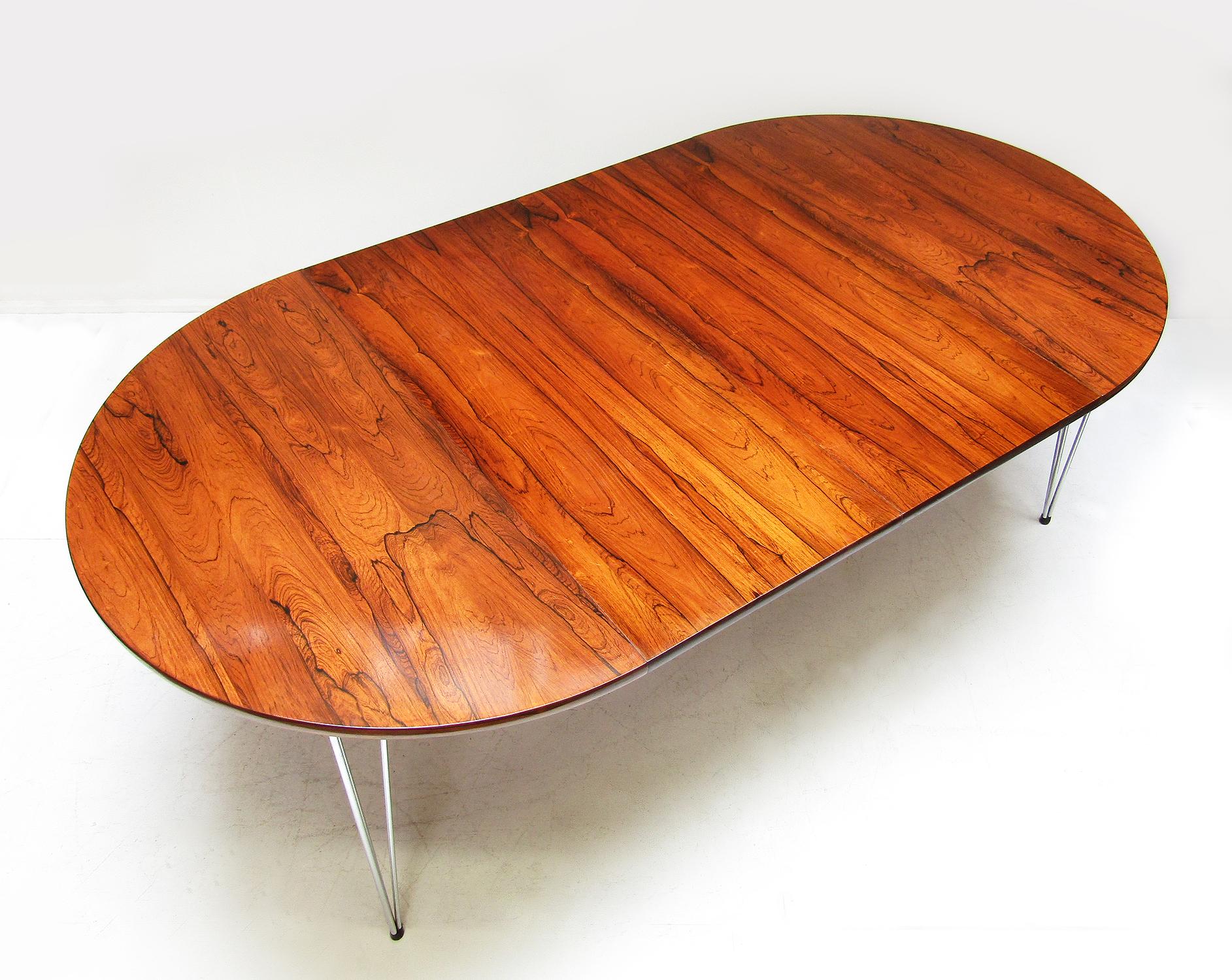 A richly figured extending dining or conference table in Rio rosewood by Hans Brattrud for Hove Mobler.

With two leaves, it can extend from 115cm diameter to an impressive length of 210cm, seating up to 12.
 
In excellent restored condition, it has