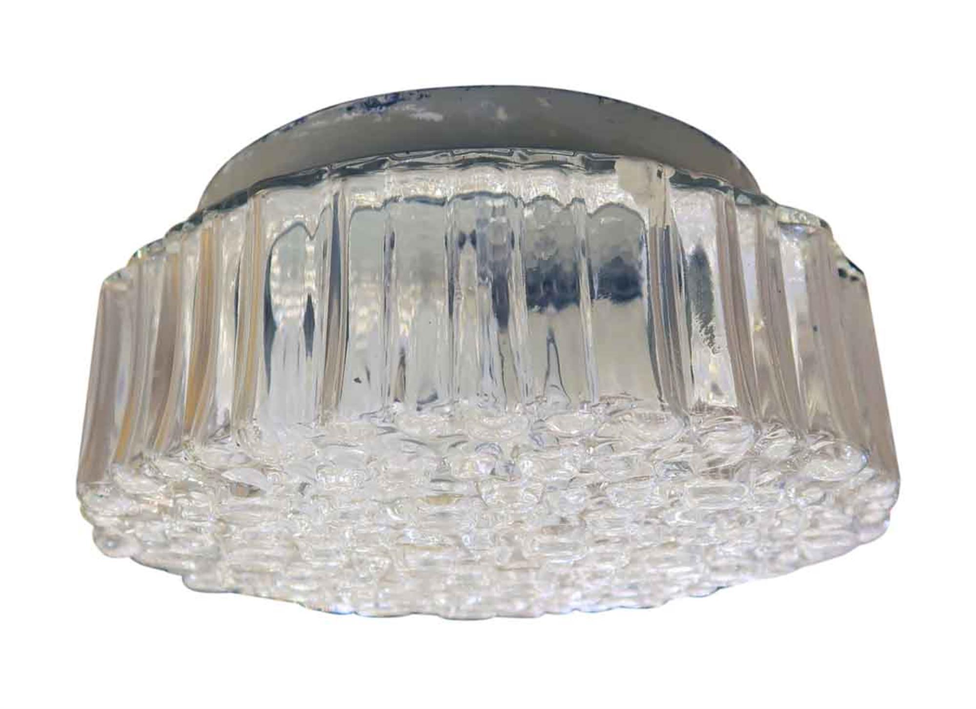 20th century Mid-Century Modern style bubbled glass flush mount light fixture salvaged from the Towers of the NYC Waldorf Astoria Hotel. Waldorf Astoria authenticity card included with your purchase. This can be seen at our 302 Bowery location in