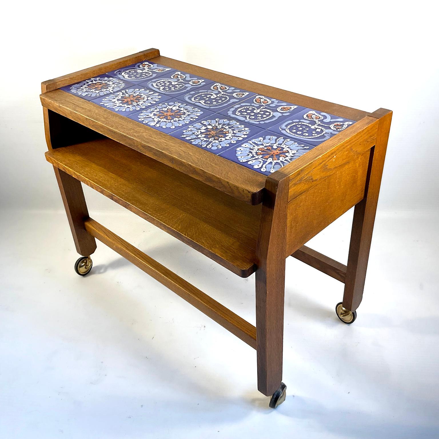 1960s Guillerme Et Chambron side table or console table with a blue ceramic tiles pattern made by Boleslaw Danikowski, ceramist appointed by the creators Guillerme and Chambron.
Edited by 