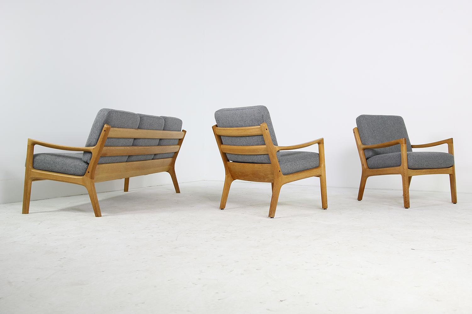 Beautiful set of 1960s Ole Wanscher easy chairs and sofa, senator series - super rare in solid oak. New upholstery in grey woven fabric. Overall a fantastic condition. Made by France & Son, Denmark.
Measures: Sofa: W 180 x D 76 x H 75cm
Chairs: W