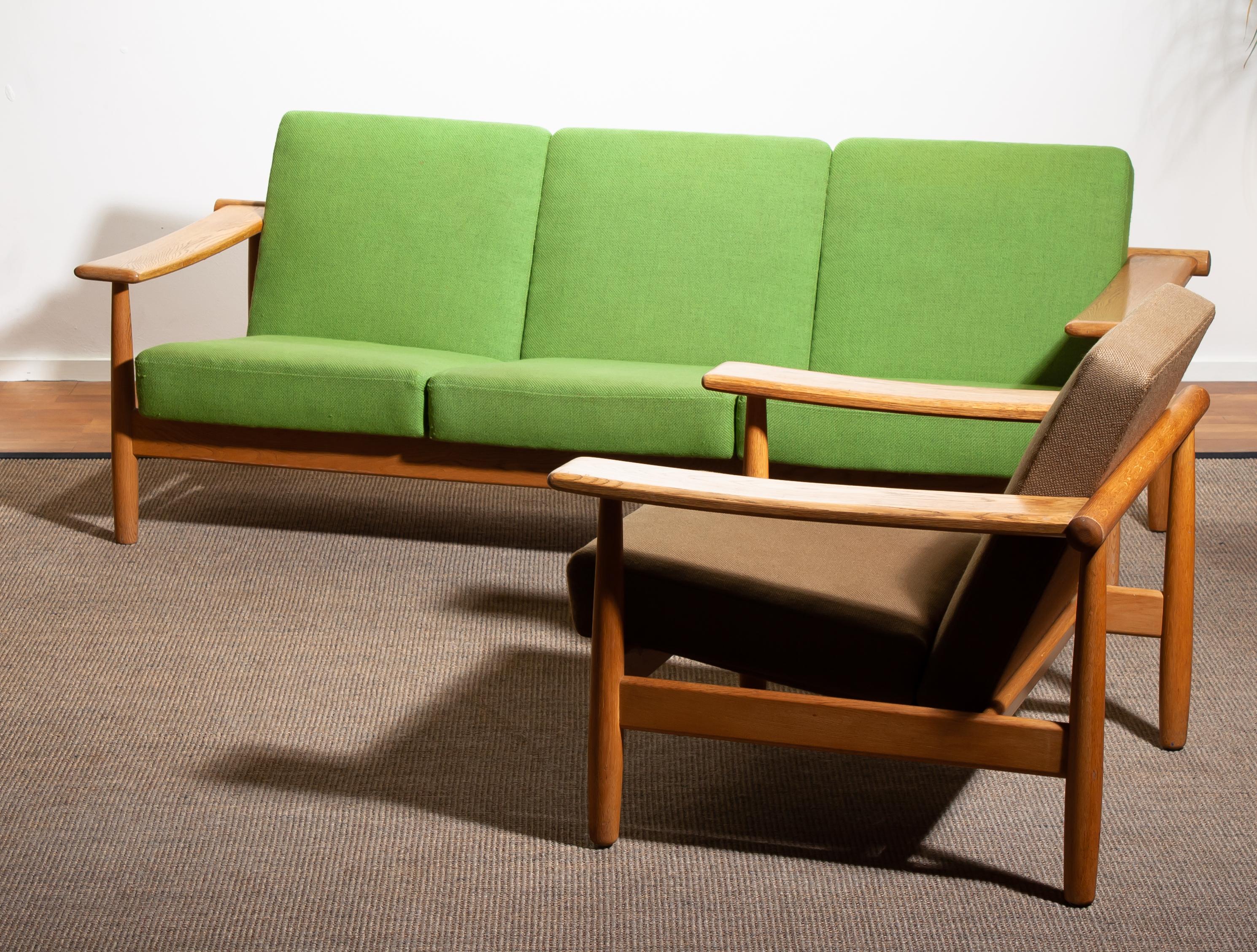 Beautiful oak sofa and lounge chair / living room set from the 1960s made in Denmark.
The oak frames are in good condition.
The fabric is in fair condition like the pictures shows.
  Beautiful set!