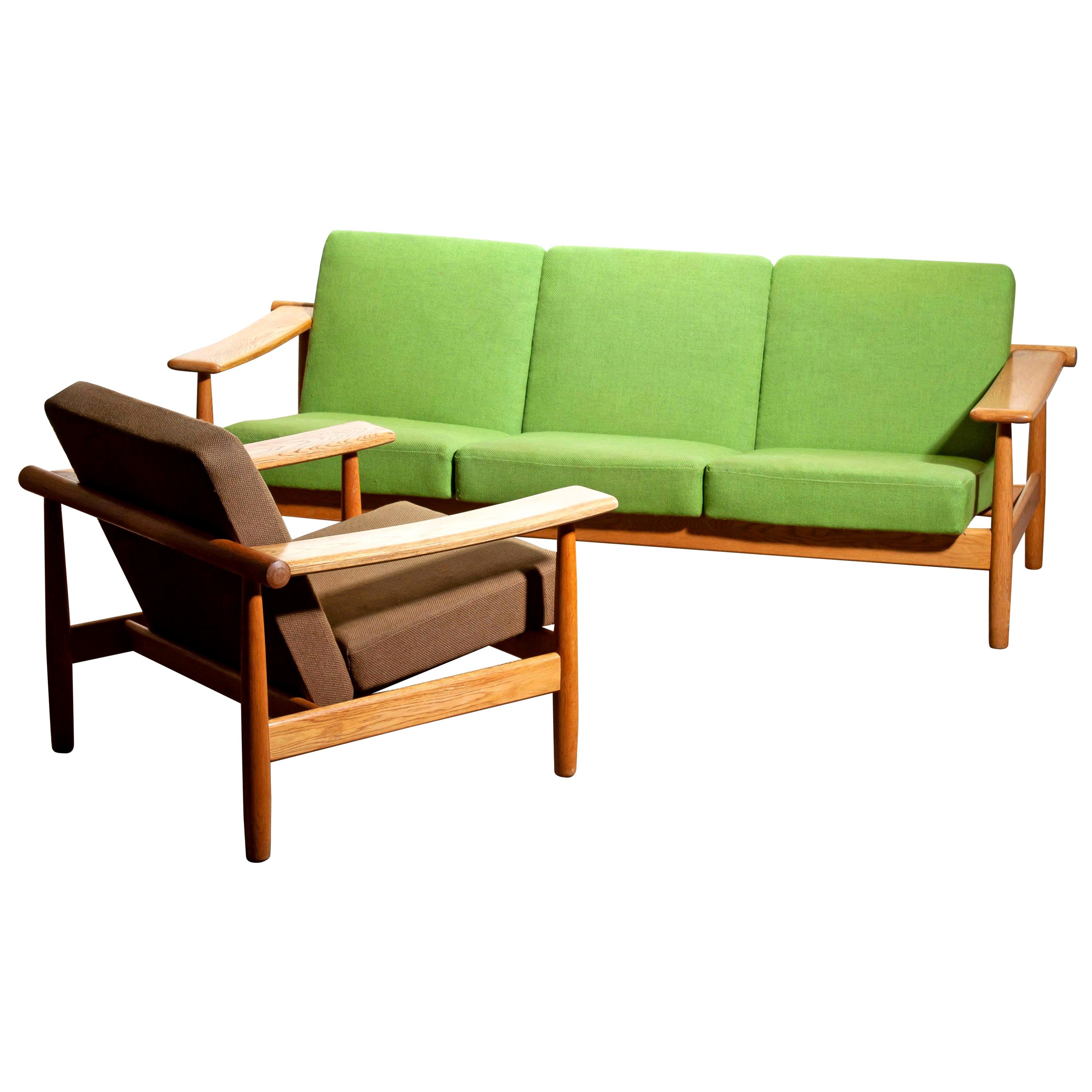 Beautiful oak sofa and lounge chair or living room set from the 1960s made in Denmark.
The oak frames are in good condition.
The fabric is in fair condition like the pictures shows.
Beautiful set!