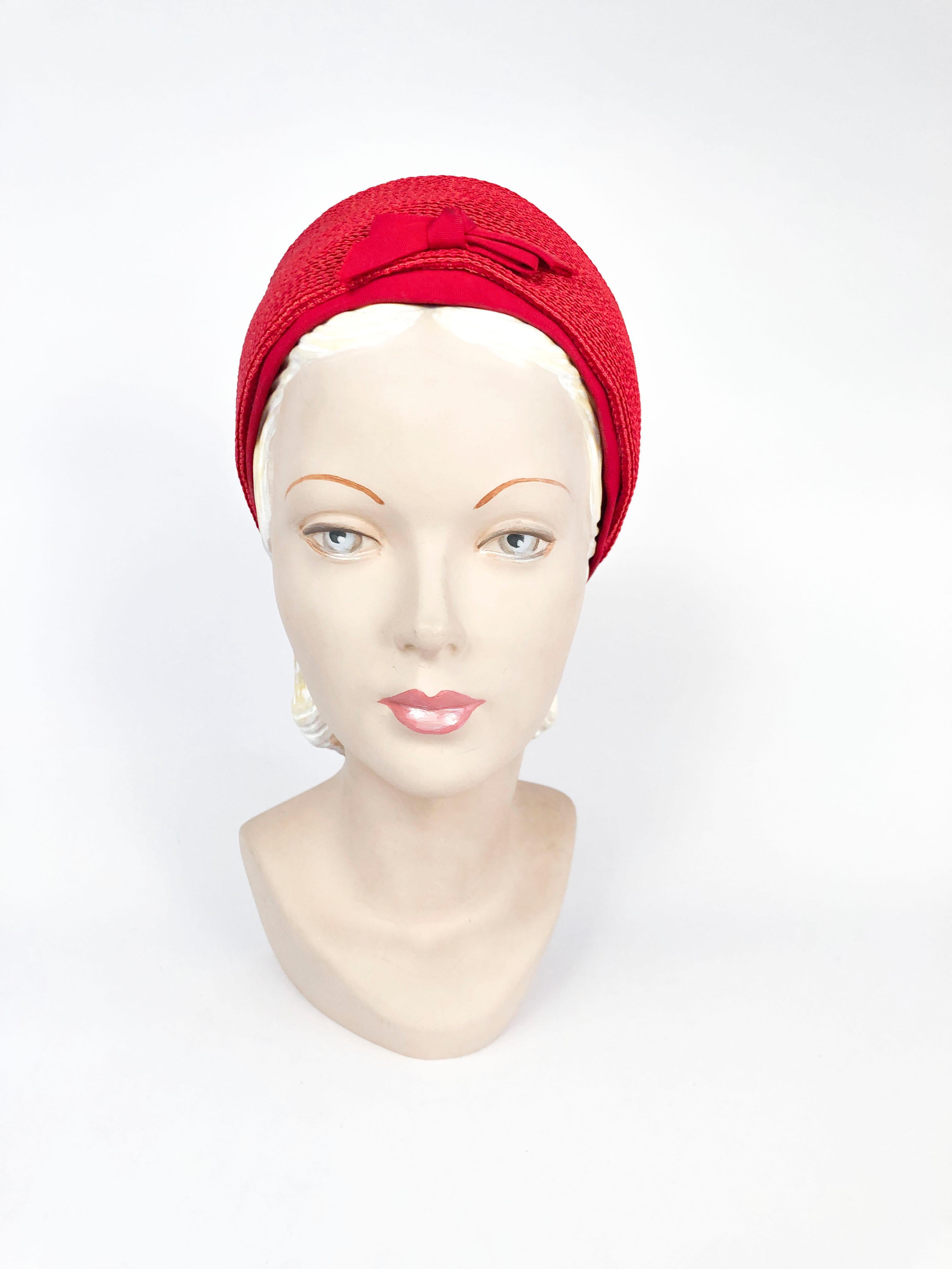 1960s Red woven straw pillbox hat with grosgrain band and matching bow centered in the front. 