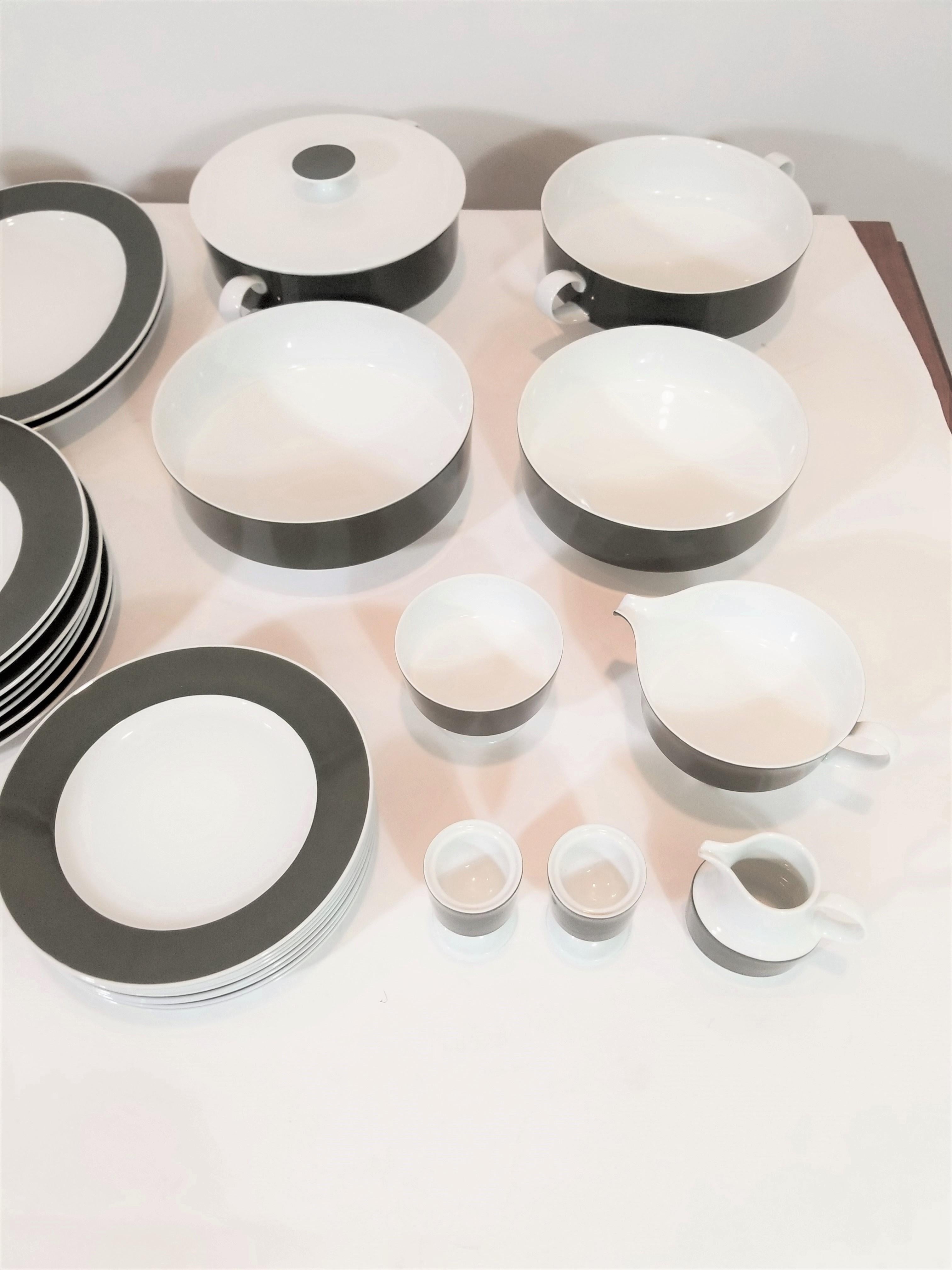 1960 midcentury dinner set consisting of 63 pieces. Elegant and modern design consistent with 1960s midcentury. The Versatile color and design allows for formal use as well as less formal. All pieces are porcelain and Marked Rosenthal. 
Excellent